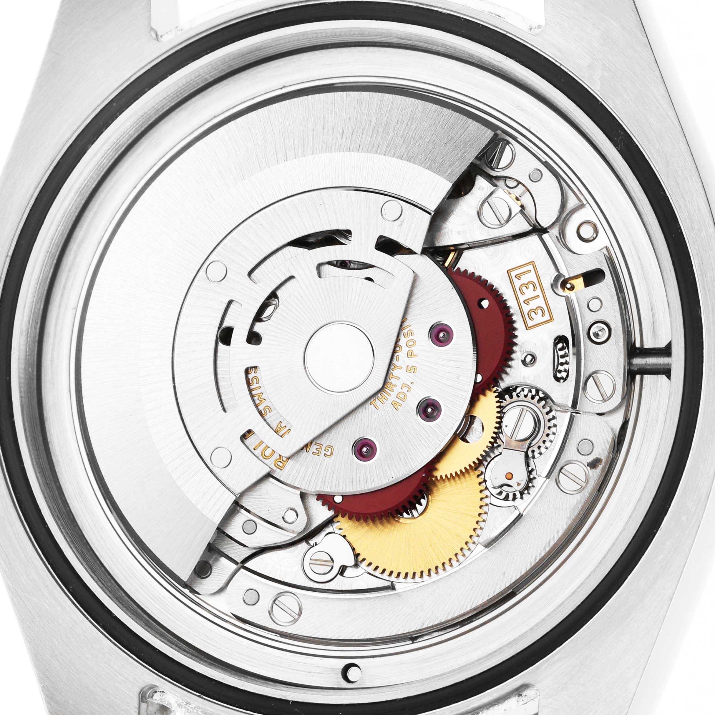The image shows the internal movement of a Rolex Milgauss 116400GV Men's Stainless Steel Black Dial watch from a top-down angle, highlighting gears and mechanisms.