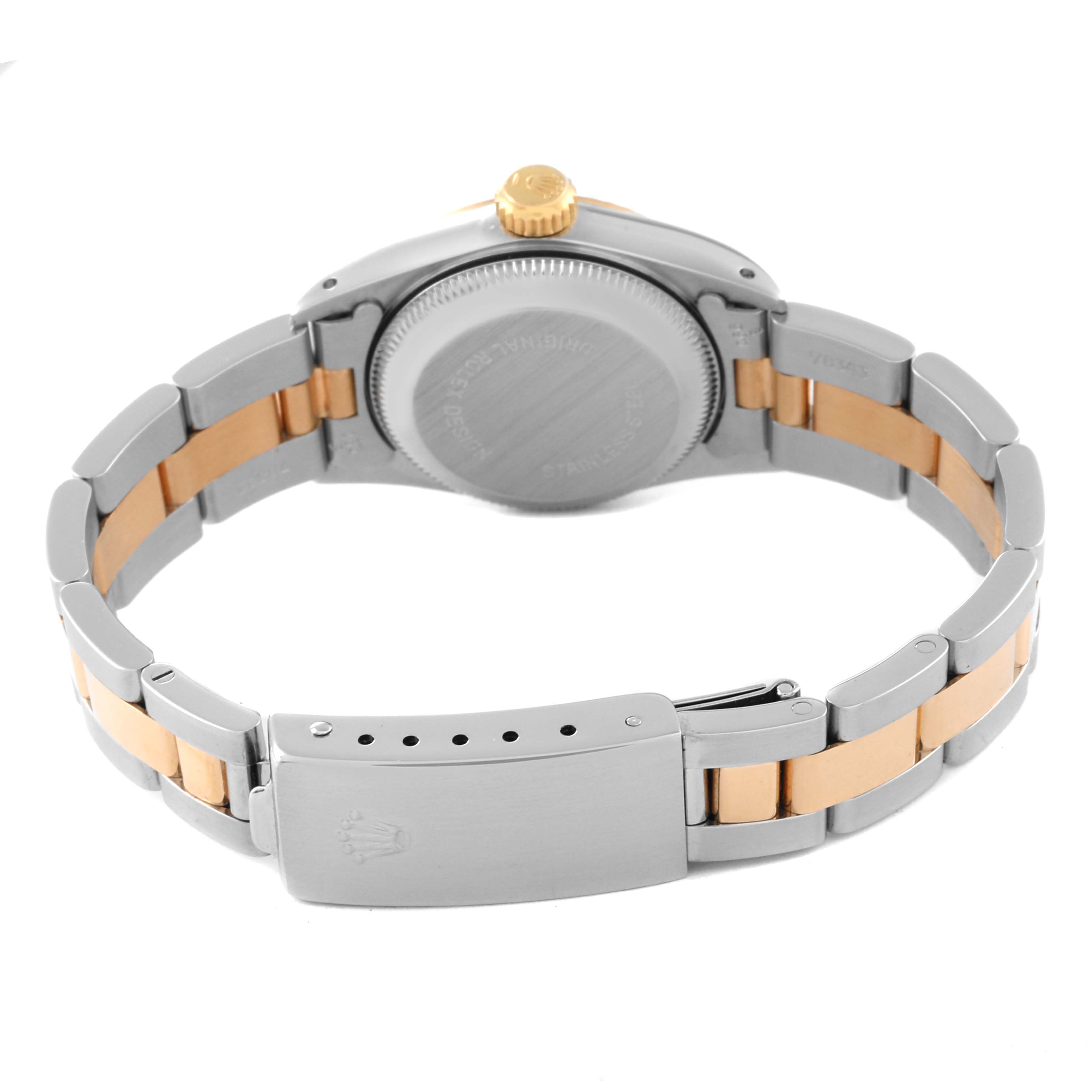 This image shows the Rolex Oyster Perpetual 67193 Women's Steel and Gold (two tone) Champagne Dial 67193 Women's Steel and Gold (two tone) Champagne Dial watch from the back, displaying its case back, crown, and clasp.