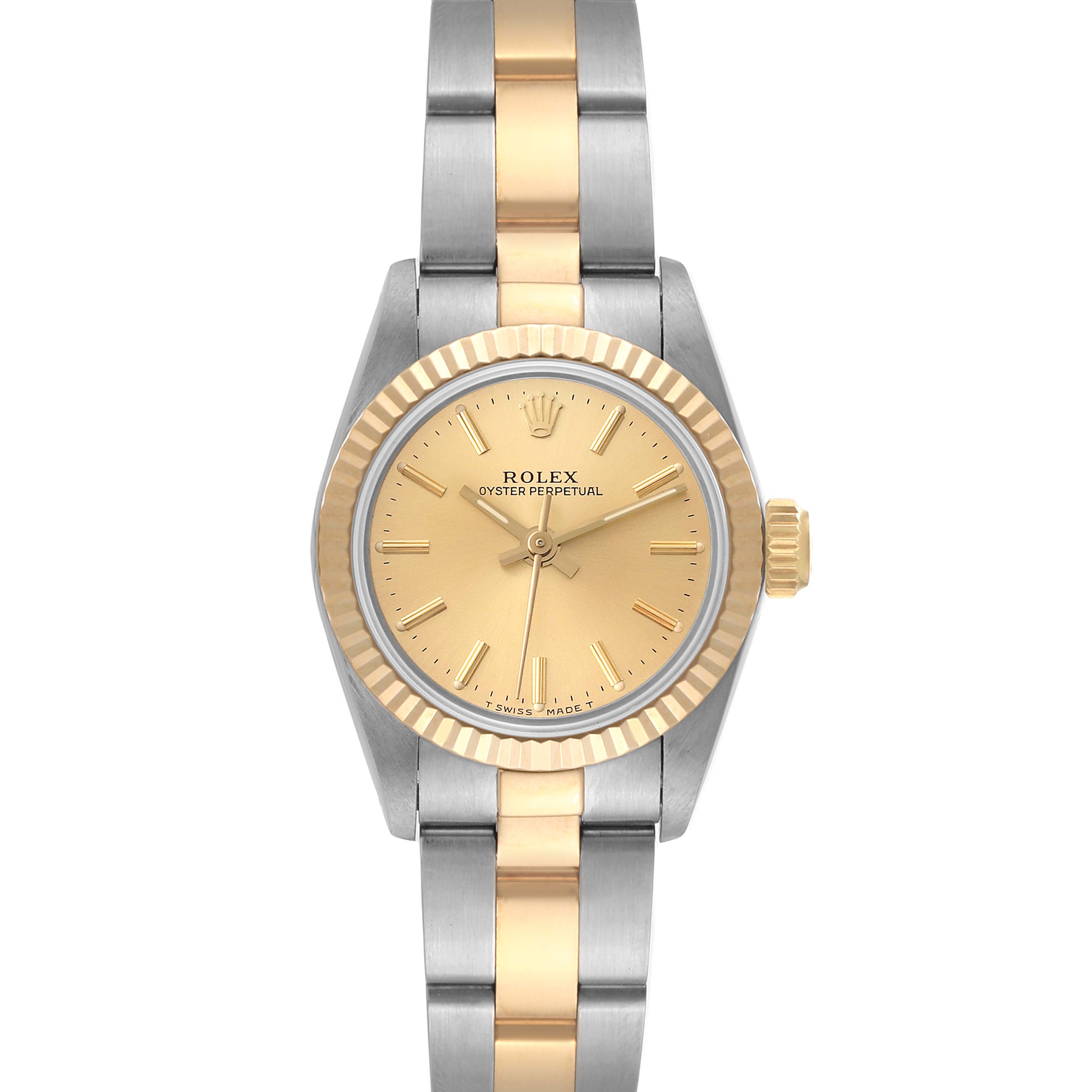 This Rolex Oyster Perpetual 67193 Women's Steel and Gold (two tone) Champagne Dial 67193 Women's Steel and Gold (two tone) Champagne Dial watch is shown from a top-down angle, highlighting its bi-metallic band, dial, and crown.