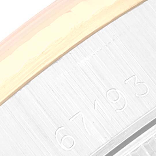 This image shows a close-up of the watch casing and edge of the bezel of a Rolex Oyster Perpetual 67193 Women's Steel and Gold (two tone) Champagne Dial 67193 Women's Steel and Gold (two tone) Champagne Dial model, containing the serial number "67193."