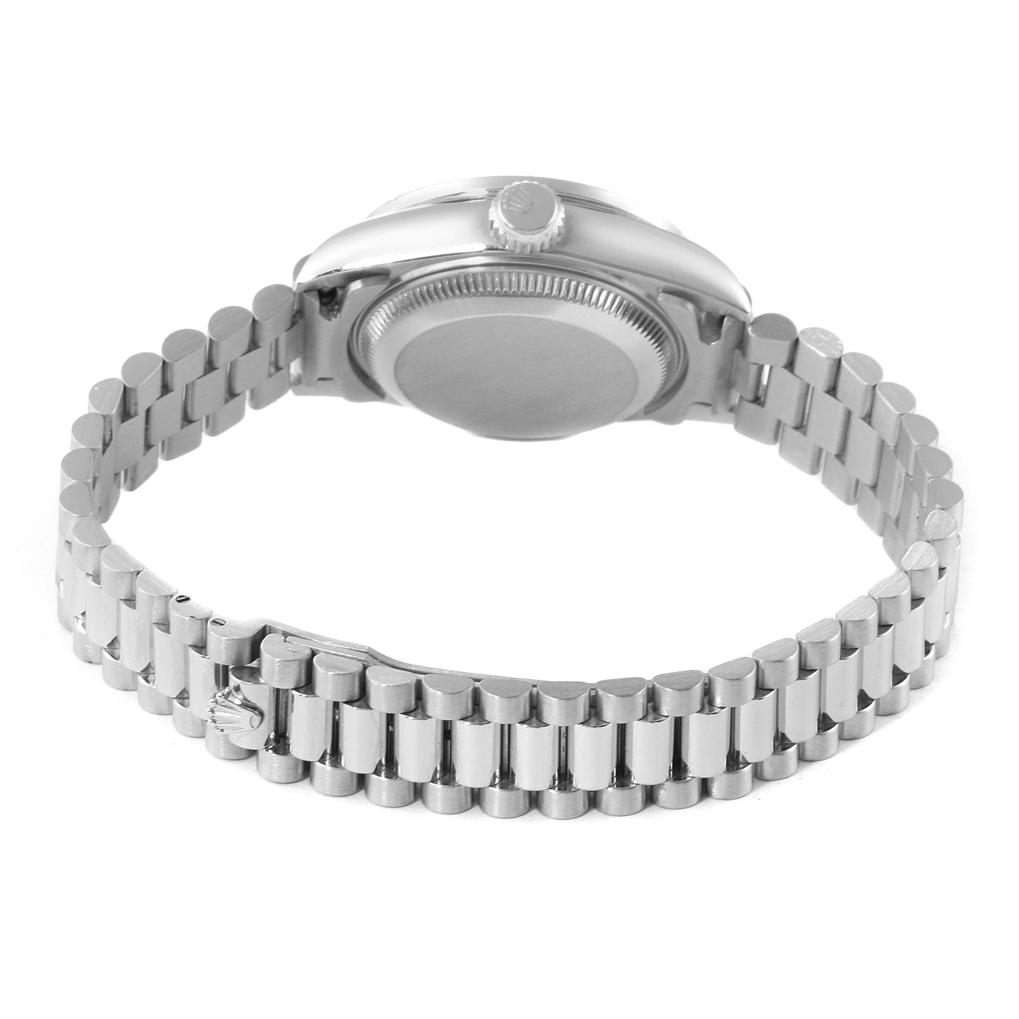 The image shows the back view of a Rolex President 69136 Women's Platinum Silver Dial 69136 Women's Platinum Silver Dial model, highlighting the watch case and bracelet.