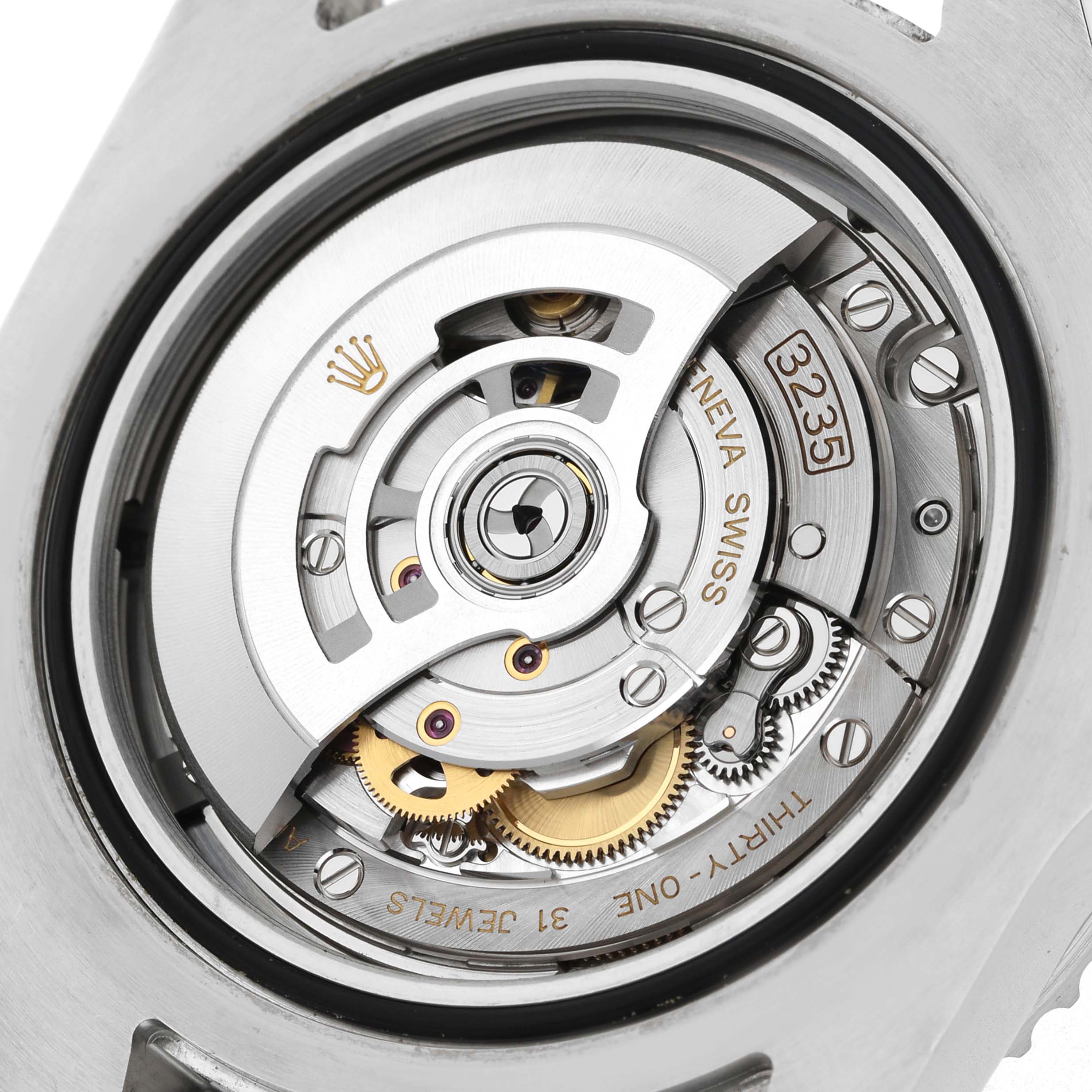The image shows a close-up of the Rolex Sea-Dweller 126600 Men's Stainless Steel Black Dial's movement mechanism, highlighting gears, jewels, and inscriptions.
