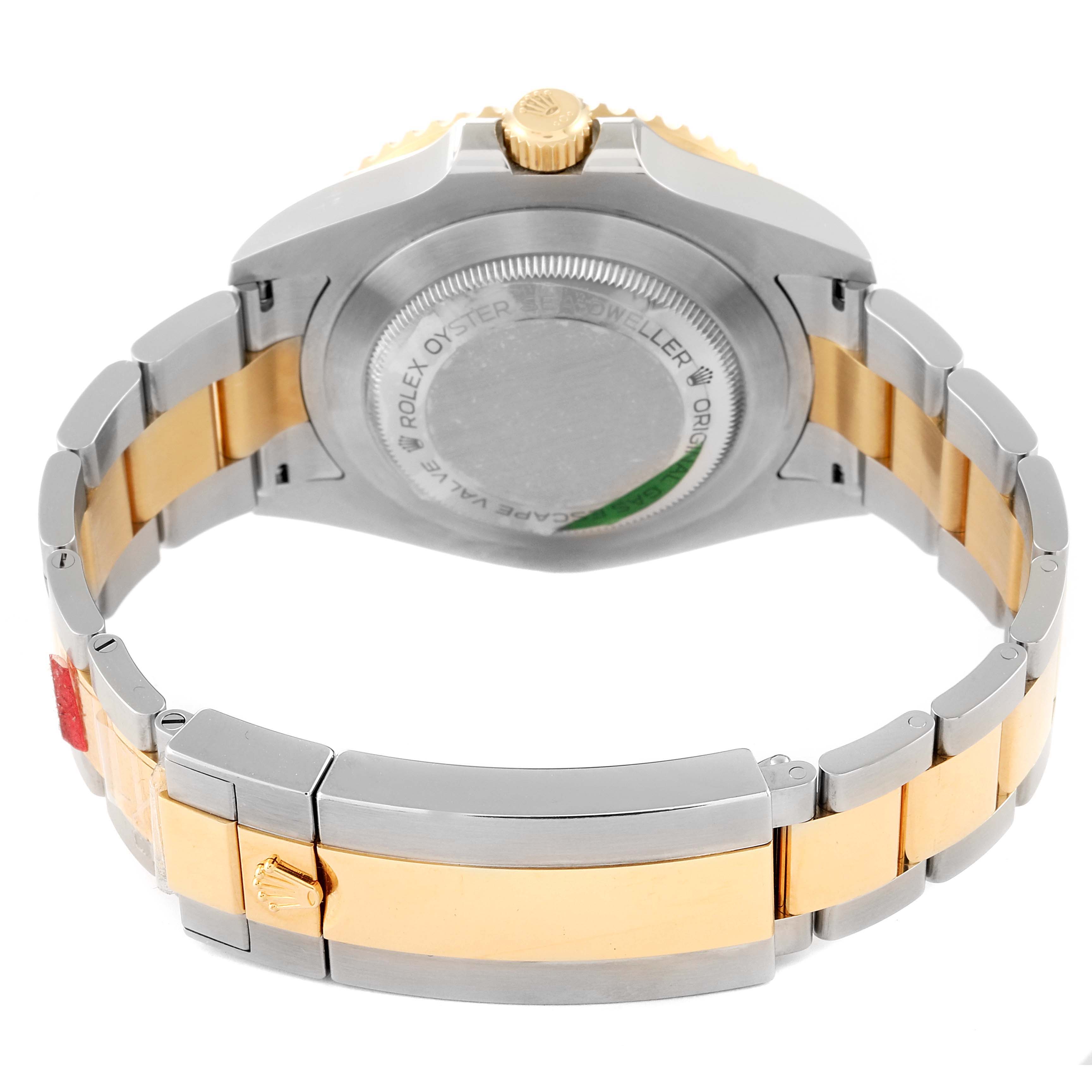 The image shows the back view of a Rolex Sea-Dweller 126603 Men's Steel and Gold (two tone) Black Dial 126603 Men's Steel and Gold (two tone) Black Dial watch, highlighting the case back, crown, and metal bracelet.