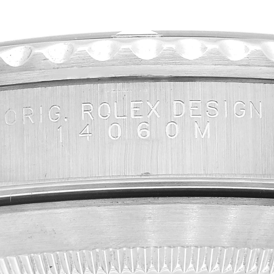 The image shows a close-up of the side of the Rolex Submariner 14060 Men's Stainless Steel Black Dial 14060 Men's Stainless Steel Black Dial, displaying the engraved model number and brand name.