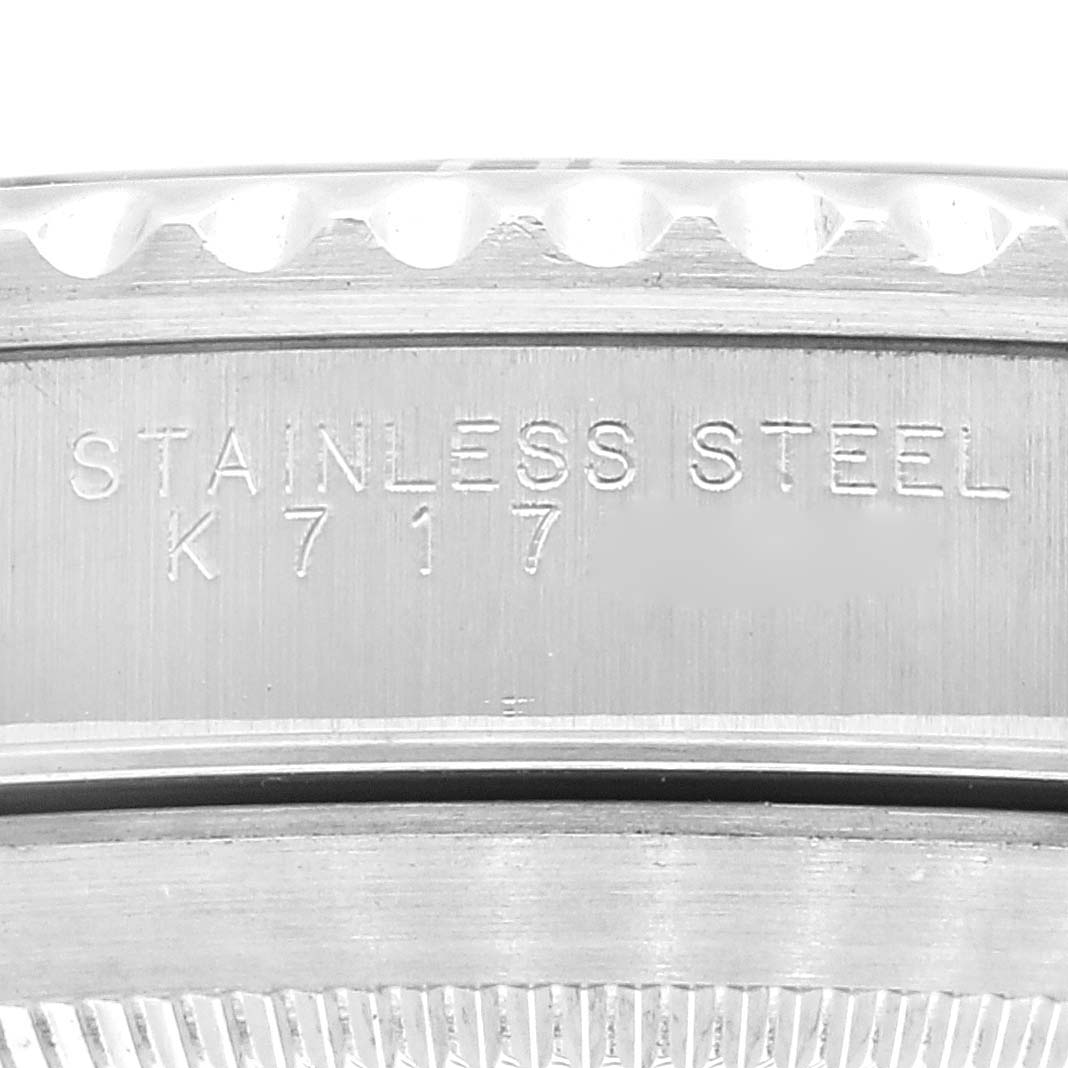 This close-up image of the Rolex Submariner 14060 Men's Stainless Steel Black Dial 14060 Men's Stainless Steel Black Dial watch shows the stainless steel casing and engravings on the side.