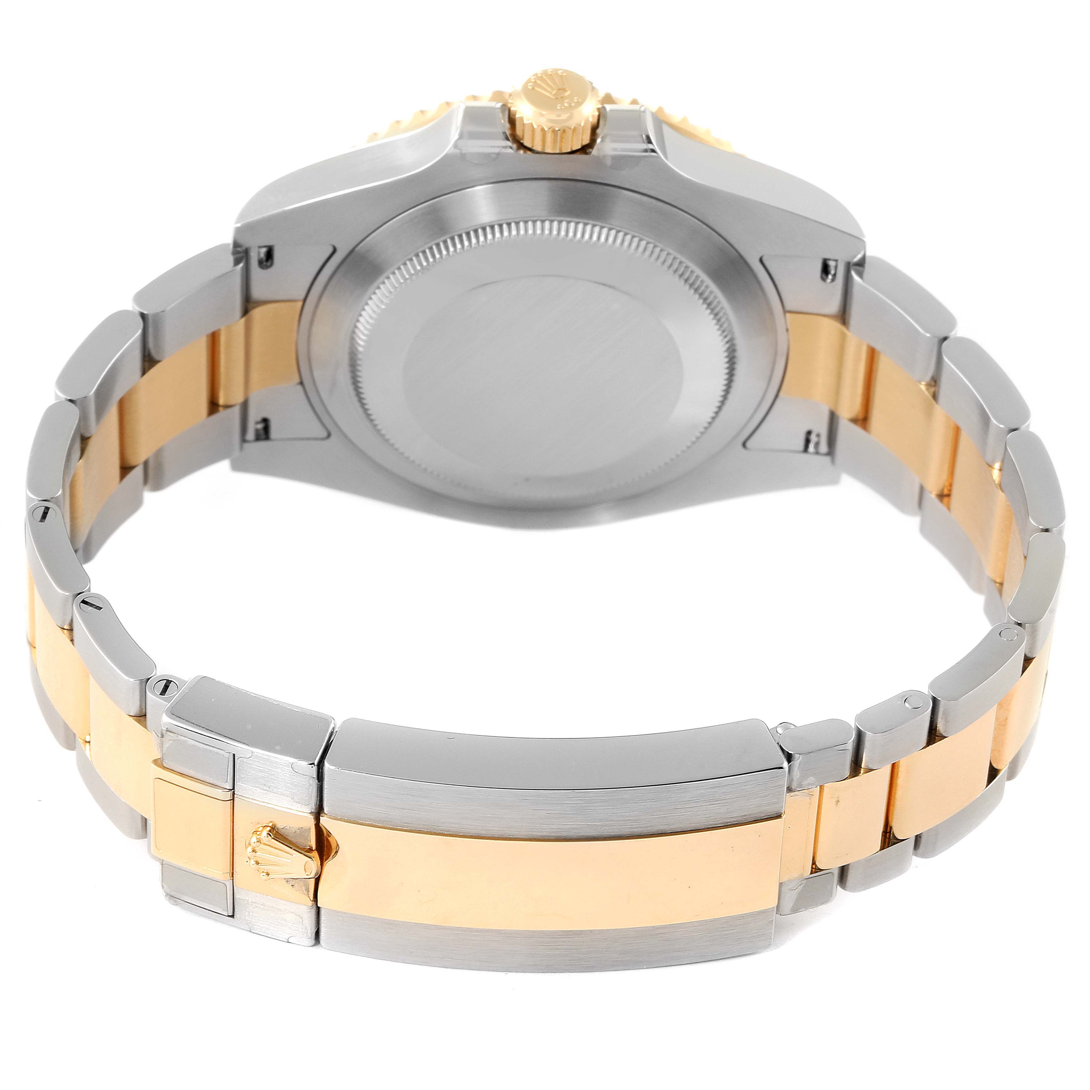 The image shows the back view of the Rolex Submariner 126613 Men
s Steel and Gold (two tone) Blue Dial 126613 Men
s Steel and Gold (two tone) Blue Dial watch, highlighting the case back and the two-tone metal bracelet.