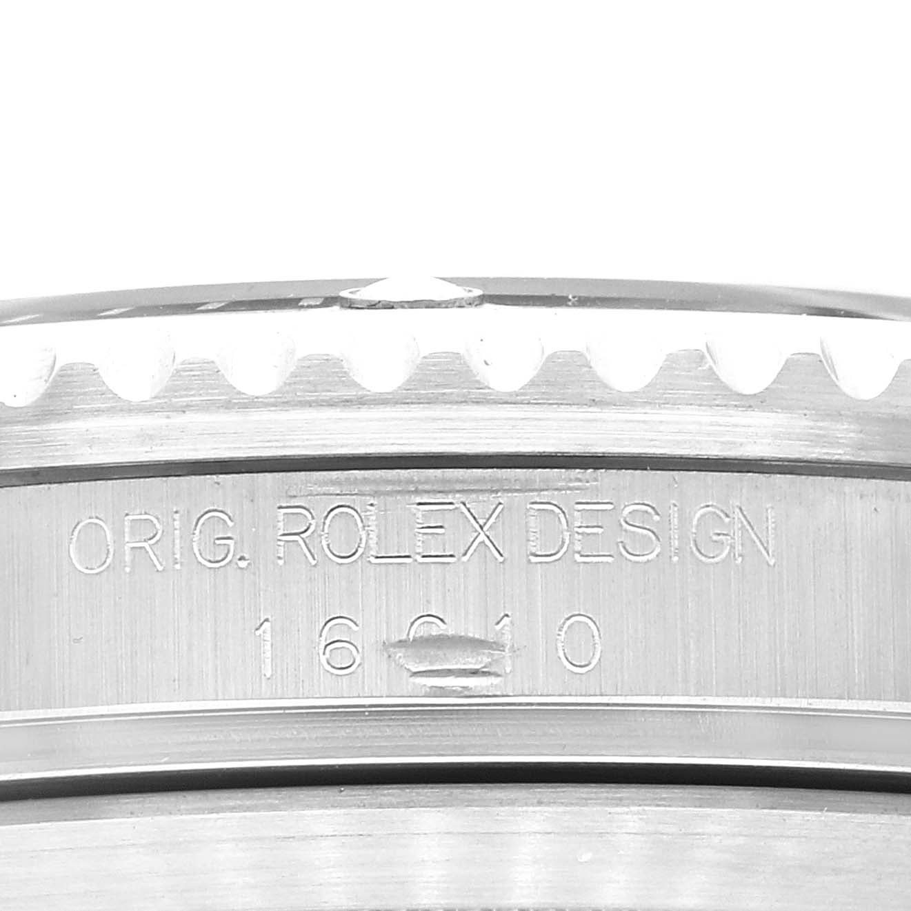 This close-up image shows the side engraving of the bezel of the Rolex Submariner 16610 Men
s Stainless Steel Black Dial 16610 Men
s Stainless Steel Black Dial watch.