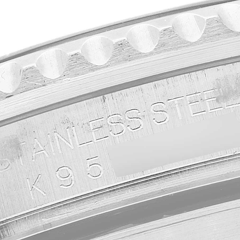 This close-up shows the engraved inner bezel and part of the outer bezel of a Rolex Submariner 16610 Men
s Stainless Steel Black Dial 16610 Men
s Stainless Steel Black Dial watch.