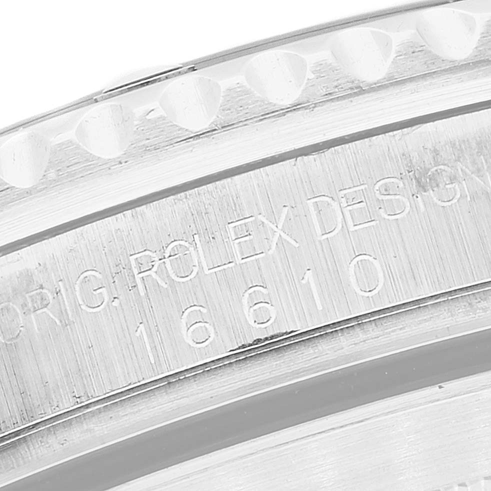 The image shows the engraved case side of a Rolex Submariner 16610 Men
s Stainless Steel Black Dial 16610 Men
s Stainless Steel Black Dial model, highlighting the reference number 16610.