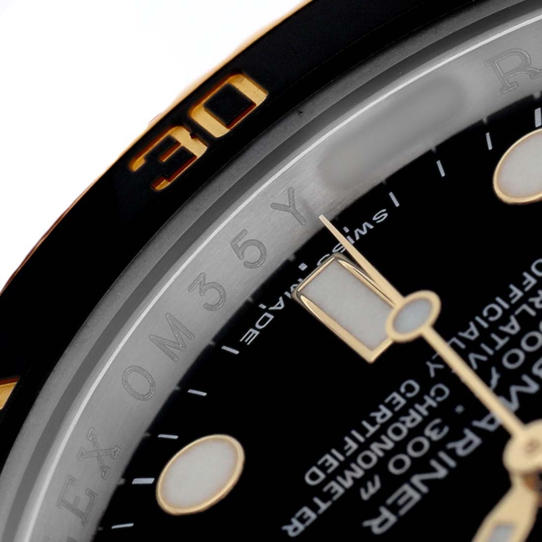 The image shows a close-up of the dial and bezel of a Rolex Submariner 116613 Men's Steel and Gold (two tone) Black Dial, focusing on the hands and minute markers.