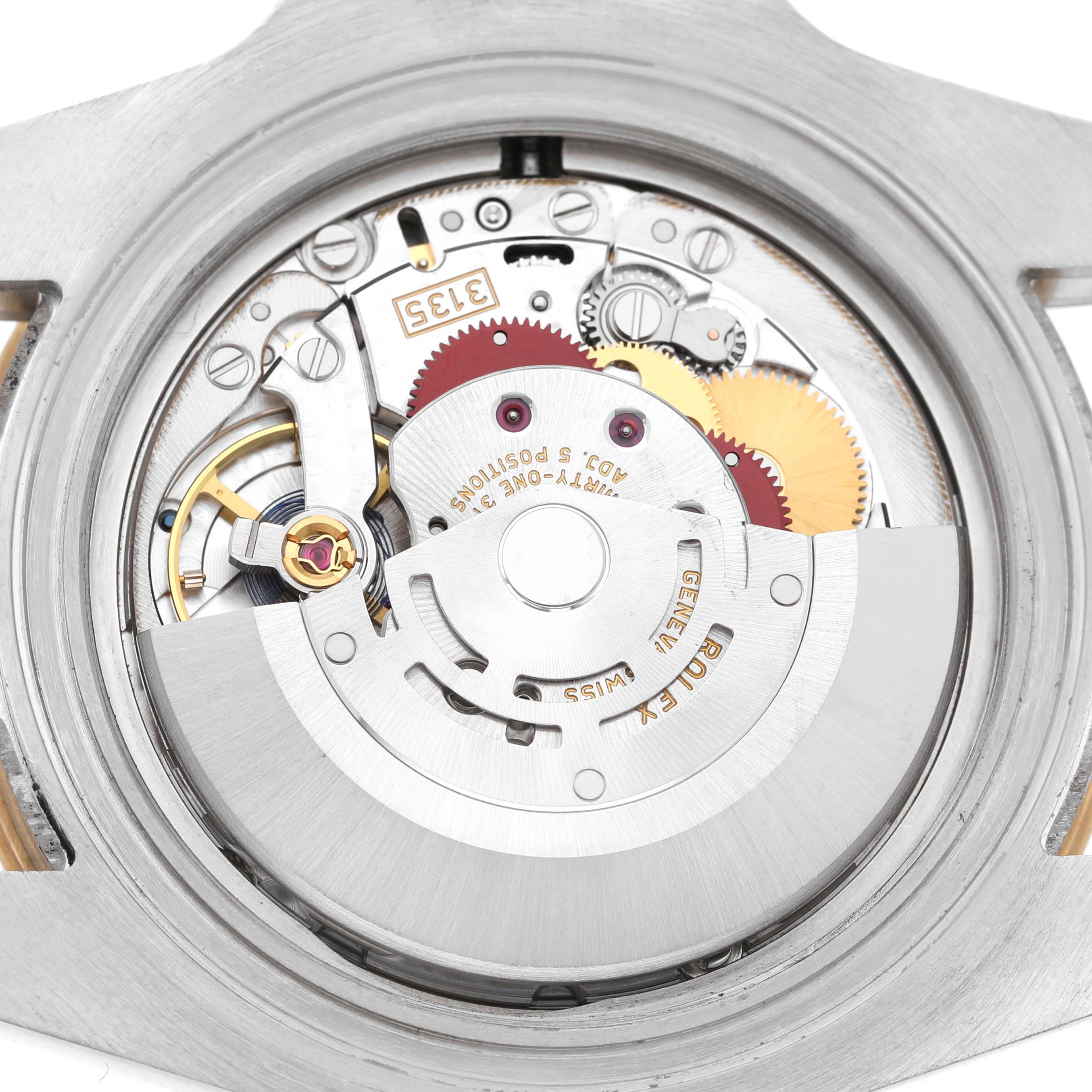 The image shows the internal movement components of a Rolex Submariner 116613 Men's Steel and Gold (two tone) Black Dial watch from a back view, highlighting gears and mechanisms.
