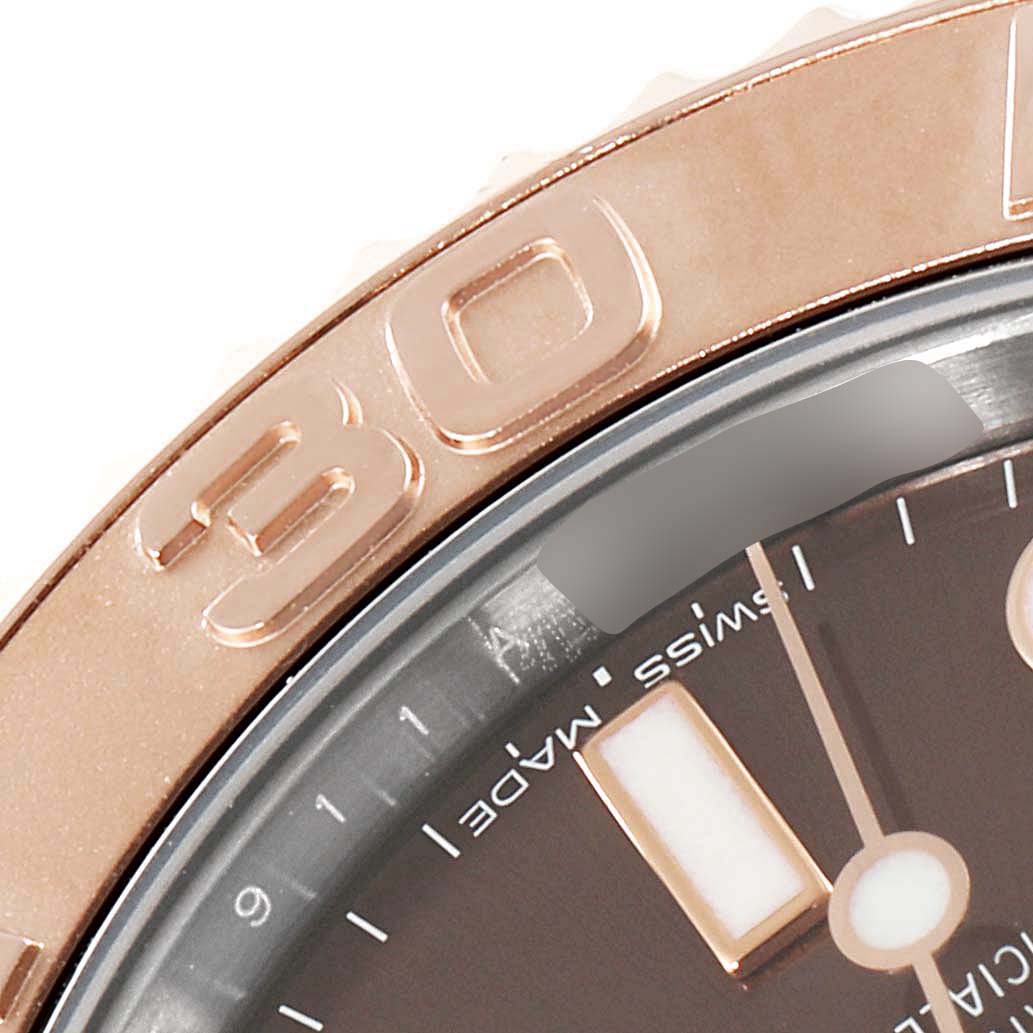 This image shows a close-up of the bezel and part of the dial of a Rolex Yacht-Master 268621 Men's Steel and Gold (two tone) Brown Dial 268621 Men's Steel and Gold (two tone) Brown Dial watch.
