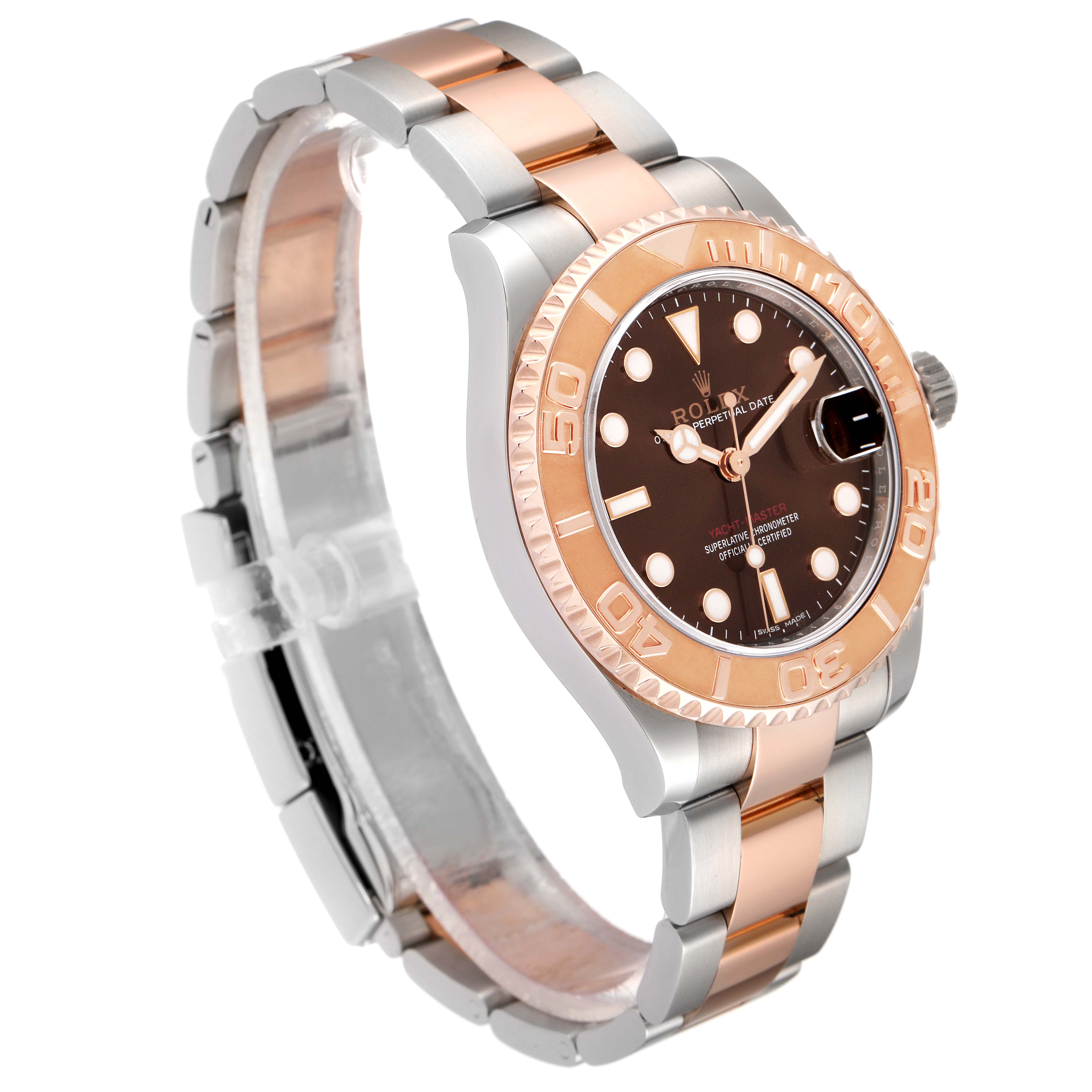 The image shows an angled view of a Rolex Yacht-Master 268621 Men's Steel and Gold (two tone) Brown Dial 268621 Men's Steel and Gold (two tone) Brown Dial watch, highlighting its dial, bezel, and two-tone bracelet.