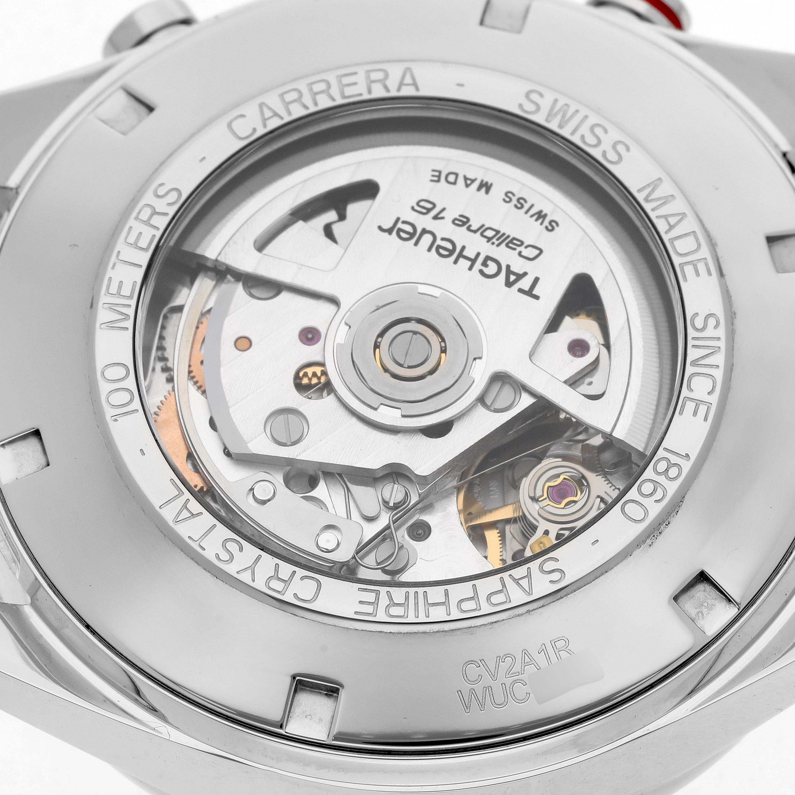 The image shows the back of a Tag Heuer Carrera CV2A1R Men's Stainless Steel Black Dial watch, highlighting its movement and sapphire crystal.
