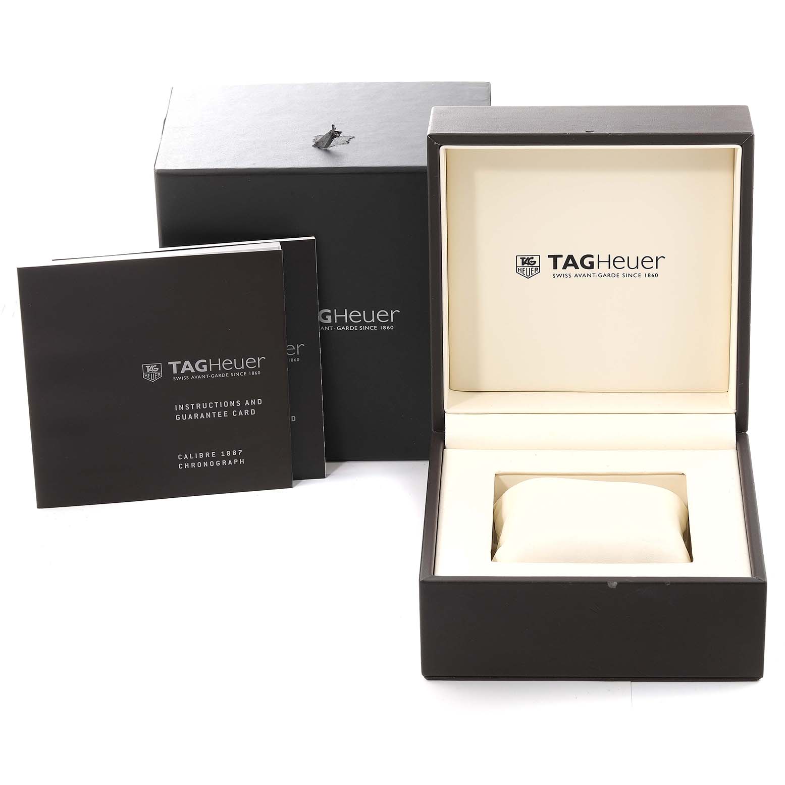 The image shows the Tag Heuer Carrera CAR2A10-2 Men's Stainless Steel Black Dial CAR2A10-2 Men's Stainless Steel Black Dial model watch's packaging, instruction booklet, guarantee card, and empty watch box.