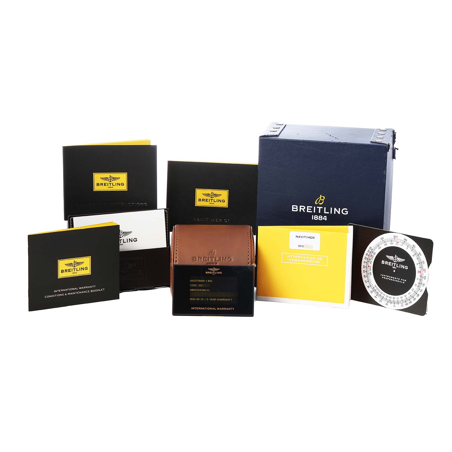 The image shows packaging and accessories for the Breitling Navitimer AB0121 Men's Stainless Steel Black Dial, including a box, manuals, warranty card, and a leather pouch.
