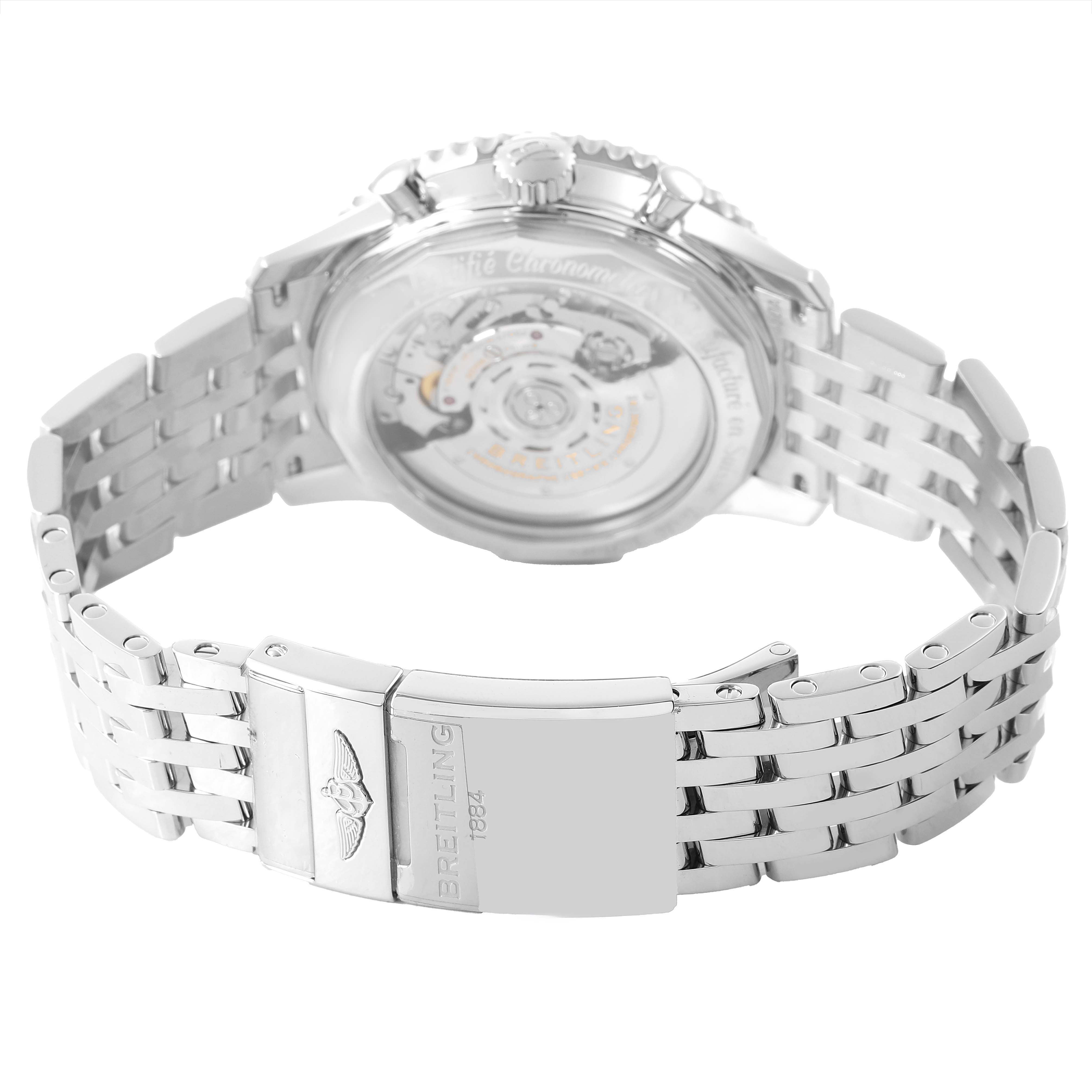 The Breitling Navitimer AB0121 Men's Stainless Steel Black Dial watch is shown from the back, highlighting the movement and metal bracelet with a branded clasp.