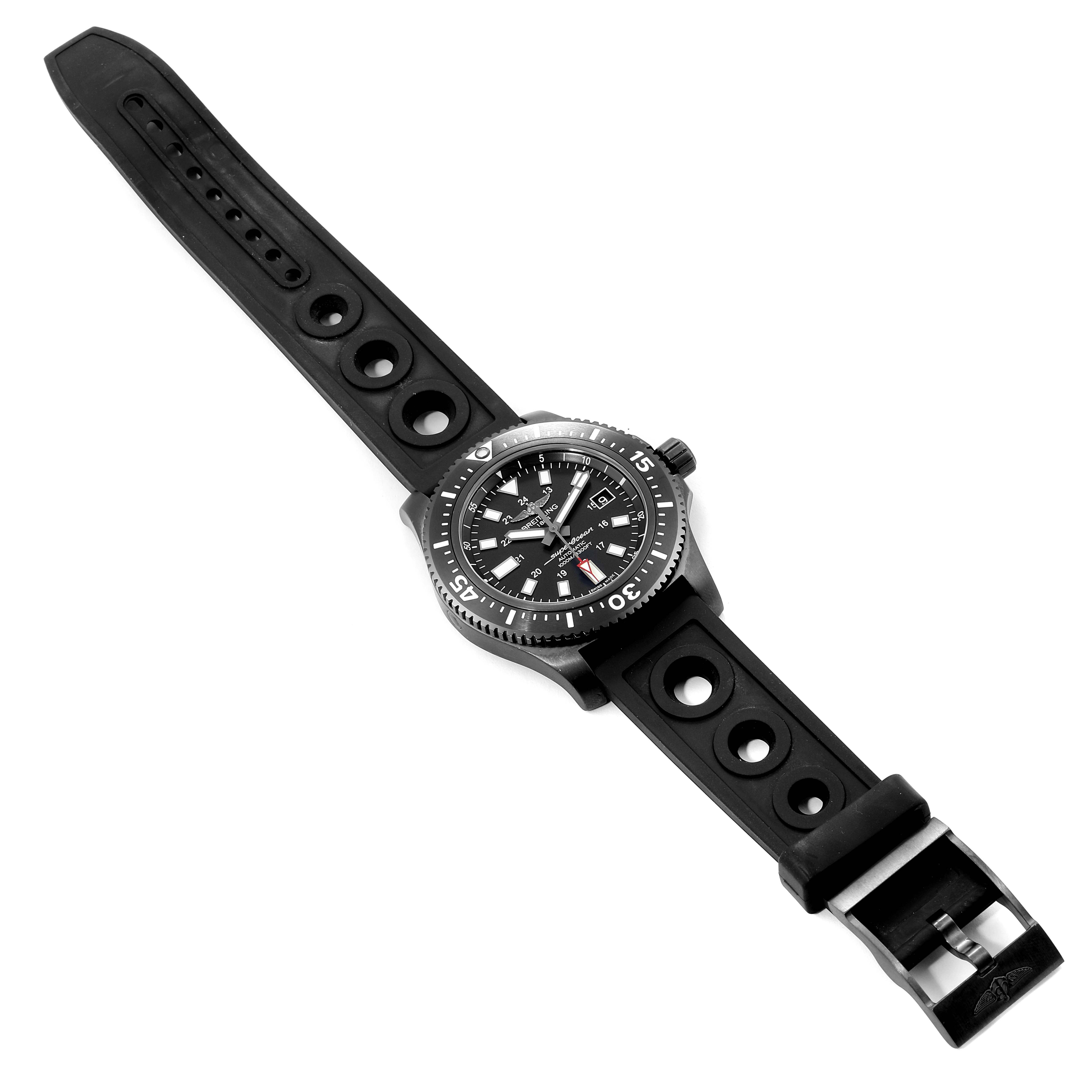 The image shows a top view of a Breitling Superocean M17393 Men's Stainless Steel Black Dial M17393 Men's Stainless Steel Black Dial watch with a black rubber strap and clasp.