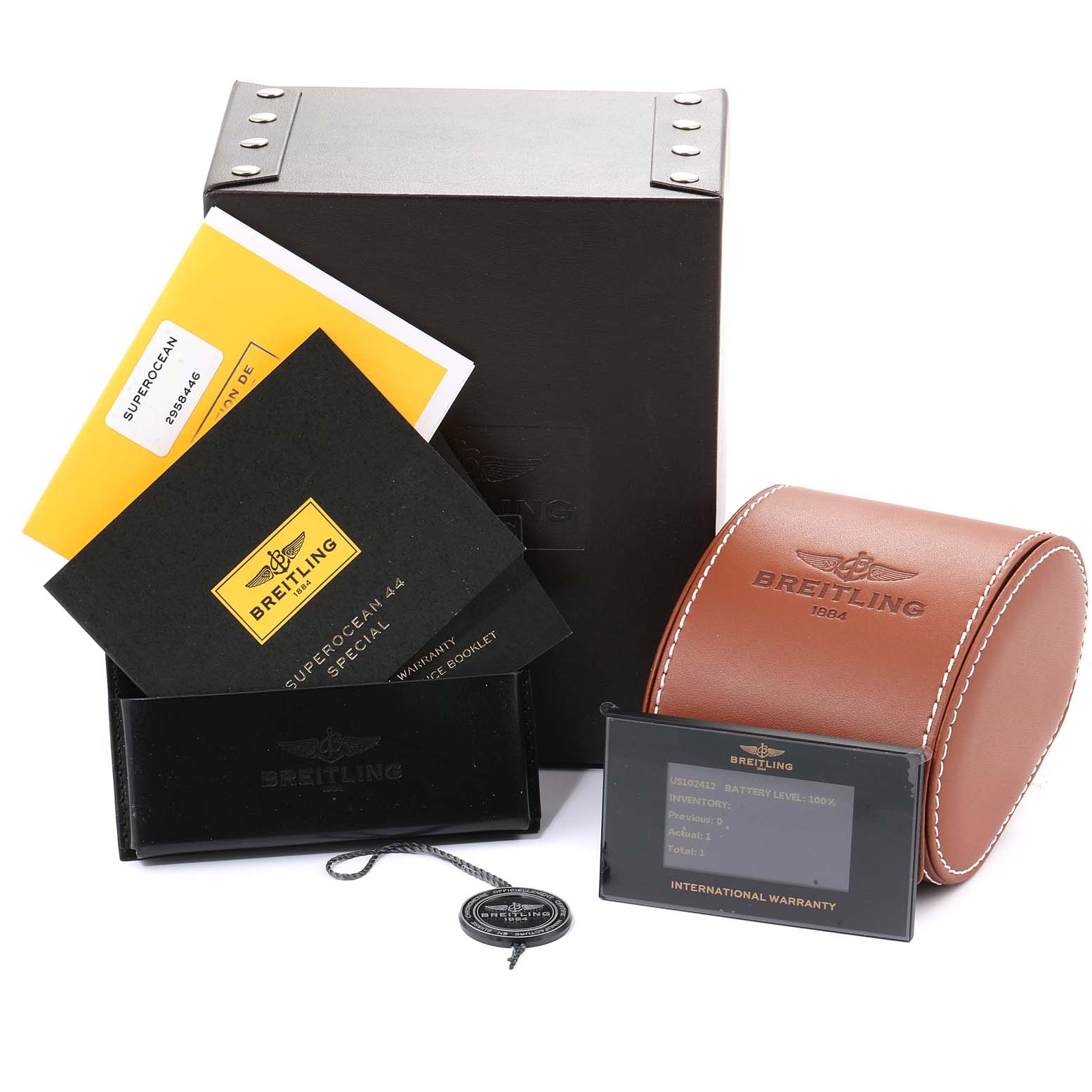 The image shows packaging, booklets, a leather watch case, a warranty card, and a tag for the Breitling Superocean M17393 Men's Stainless Steel Black Dial M17393 Men's Stainless Steel Black Dial model.