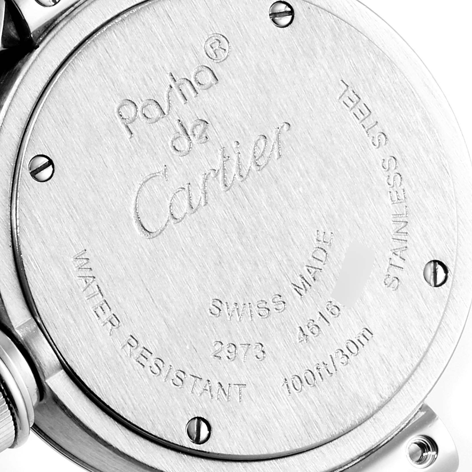 The image shows the back case of a Cartier Pasha W3140007 Women
s Stainless Steel Silver Dial W3140007 Women
s Stainless Steel Silver Dial watch, highlighting its engravings and screws.