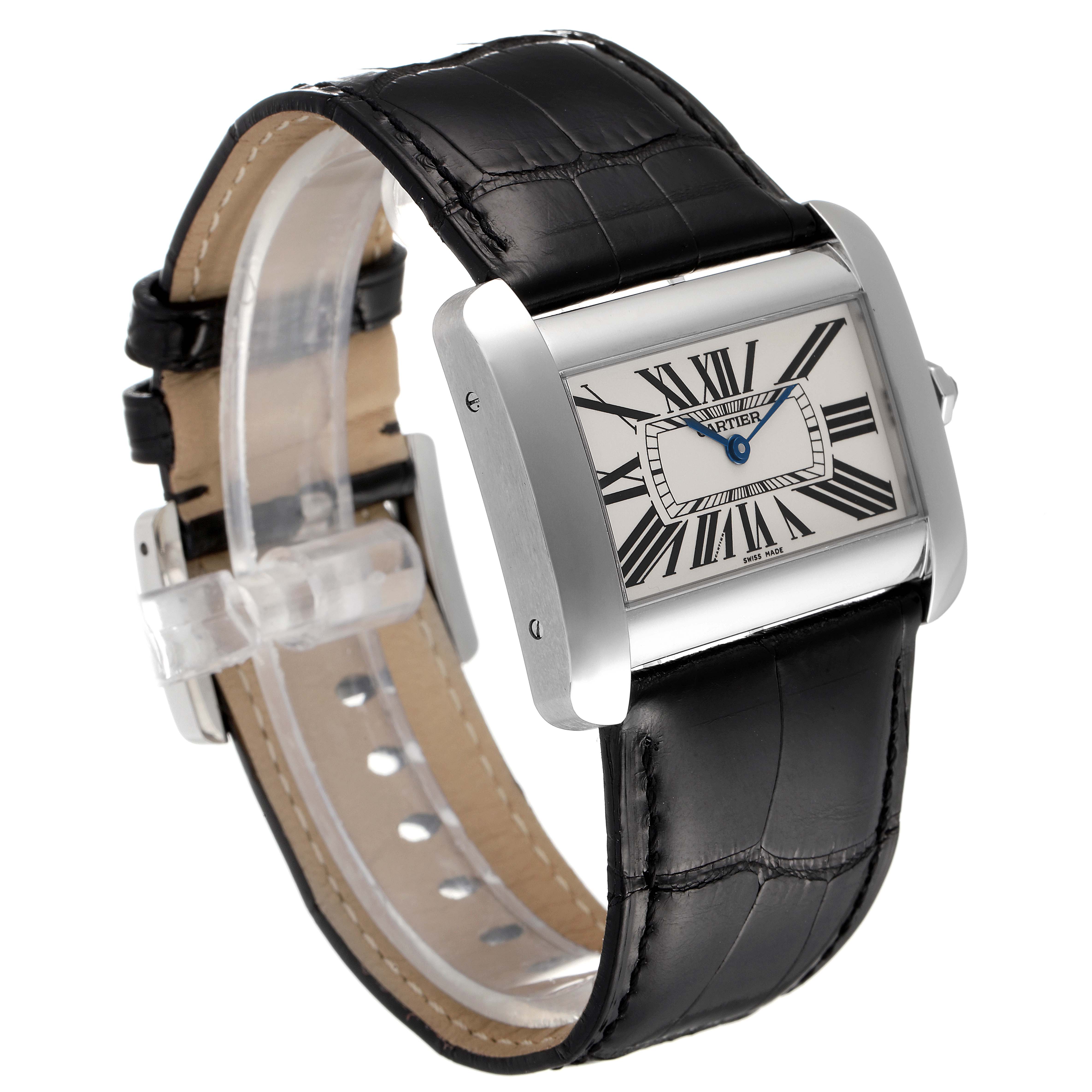 The image shows a Cartier Tank Divan W6300755 Women
s Stainless Steel Silver Dial W6300755 Women
s Stainless Steel Silver Dial watch at an angle, highlighting its rectangular case, Roman numeral dial, and black leather strap.