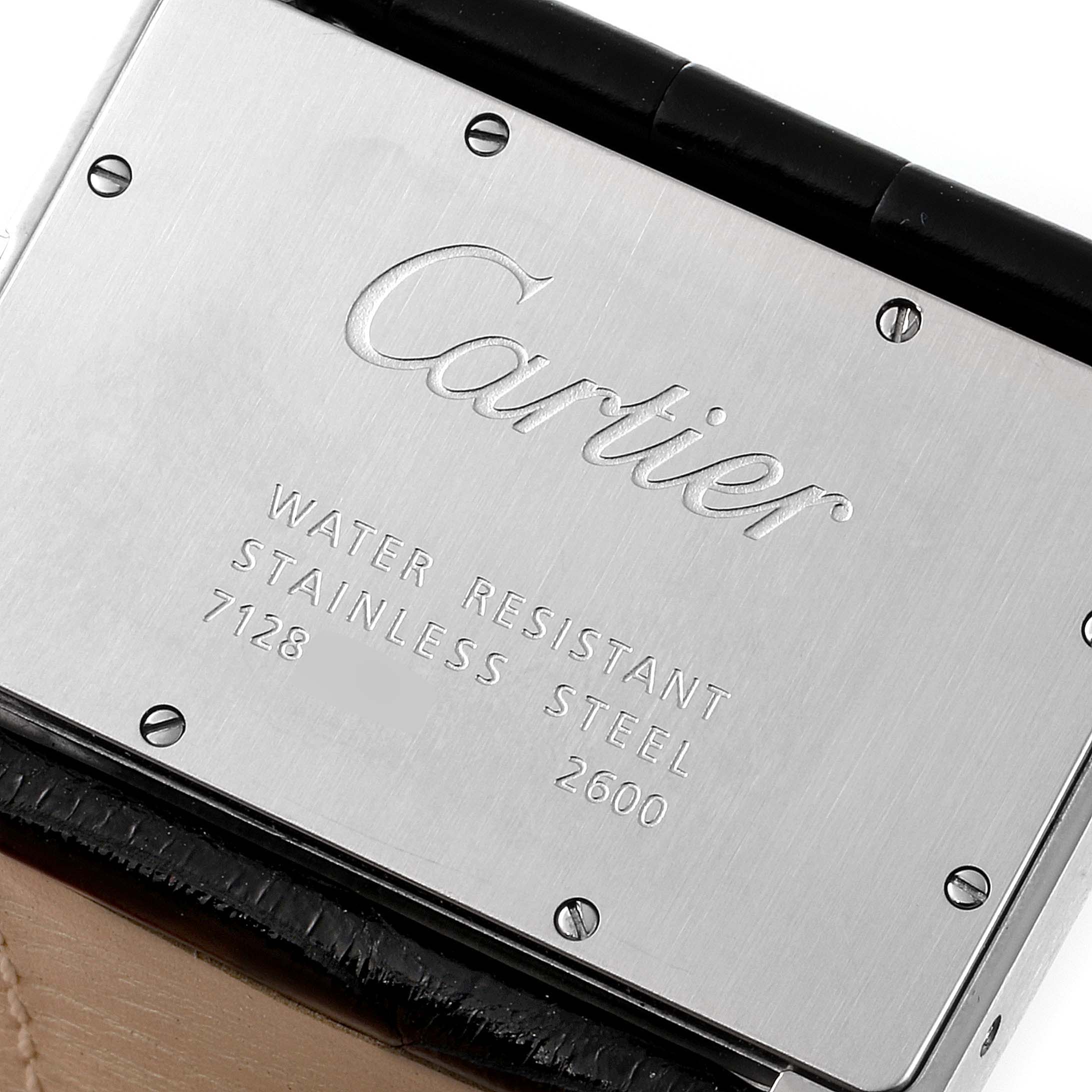 The image shows the back case of a Tank Divan model by Cartier, highlighting its water resistance and stainless steel properties.