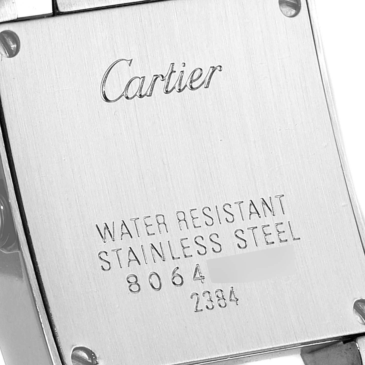 This image shows the back casing of a Cartier Tank Francaise W51028Q3 Women
s Stainless Steel Mother of Pearl Dial W51028Q3 Women
s Stainless Steel Mother of Pearl Dial watch, highlighting the brand name and material details.