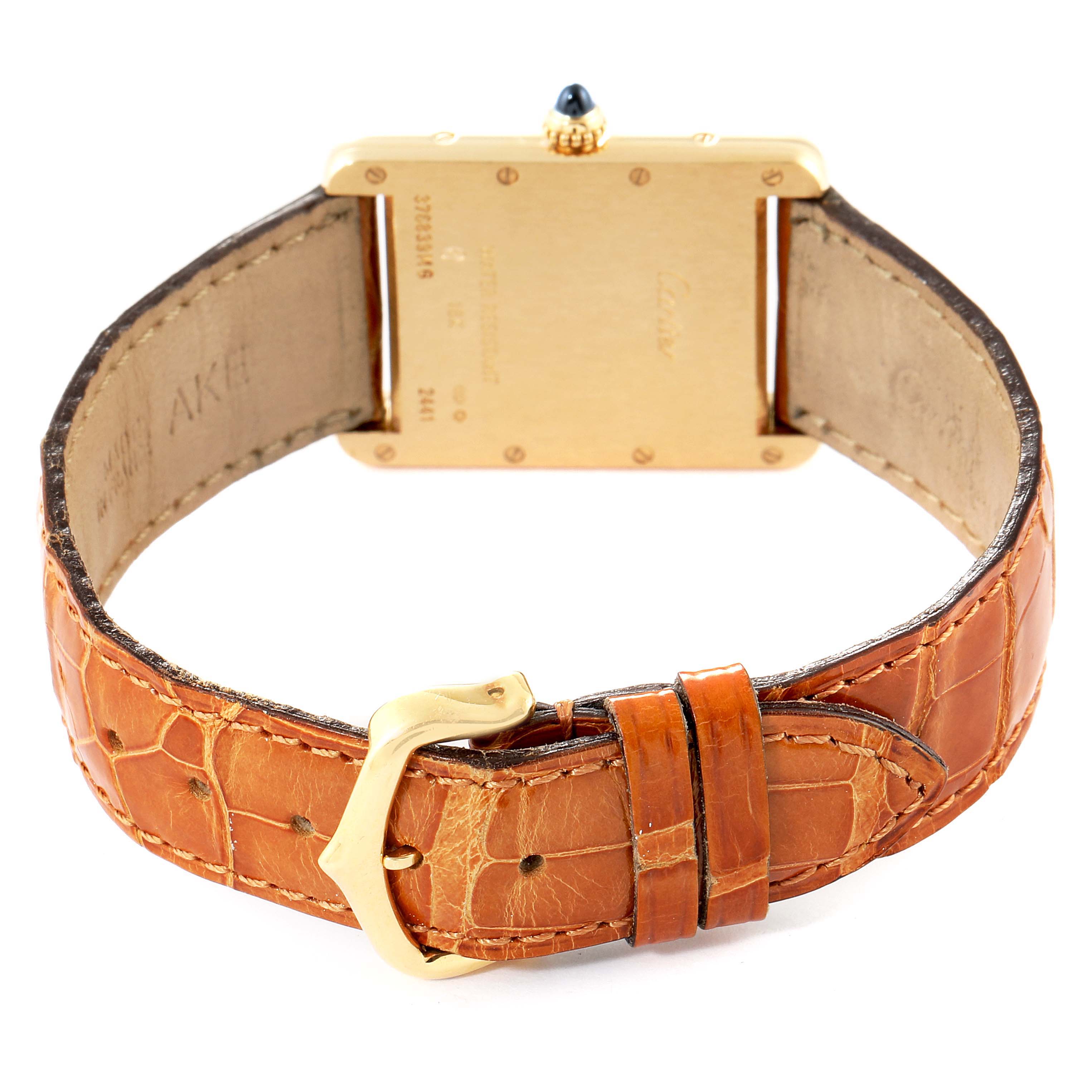 The image shows the back view of a Tank Louis model by Cartier with a brown leather strap and gold buckle.