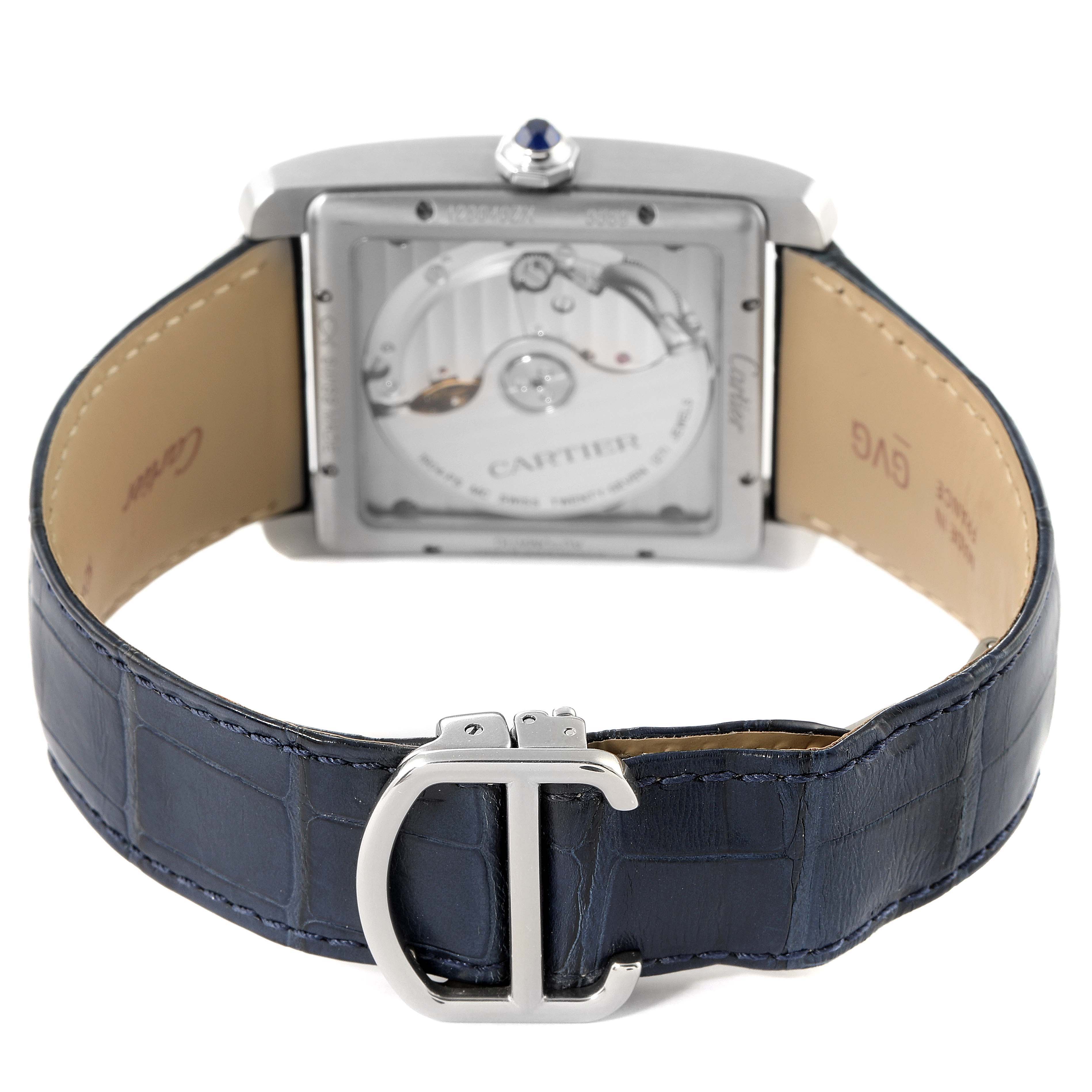 The image shows the back and clasp of the Cartier Tank MC WSTA0010 Men
s Stainless Steel Blue Dial WSTA0010 Men
s Stainless Steel Blue Dial watch, displaying its blue leather strap and visible mechanical movement.