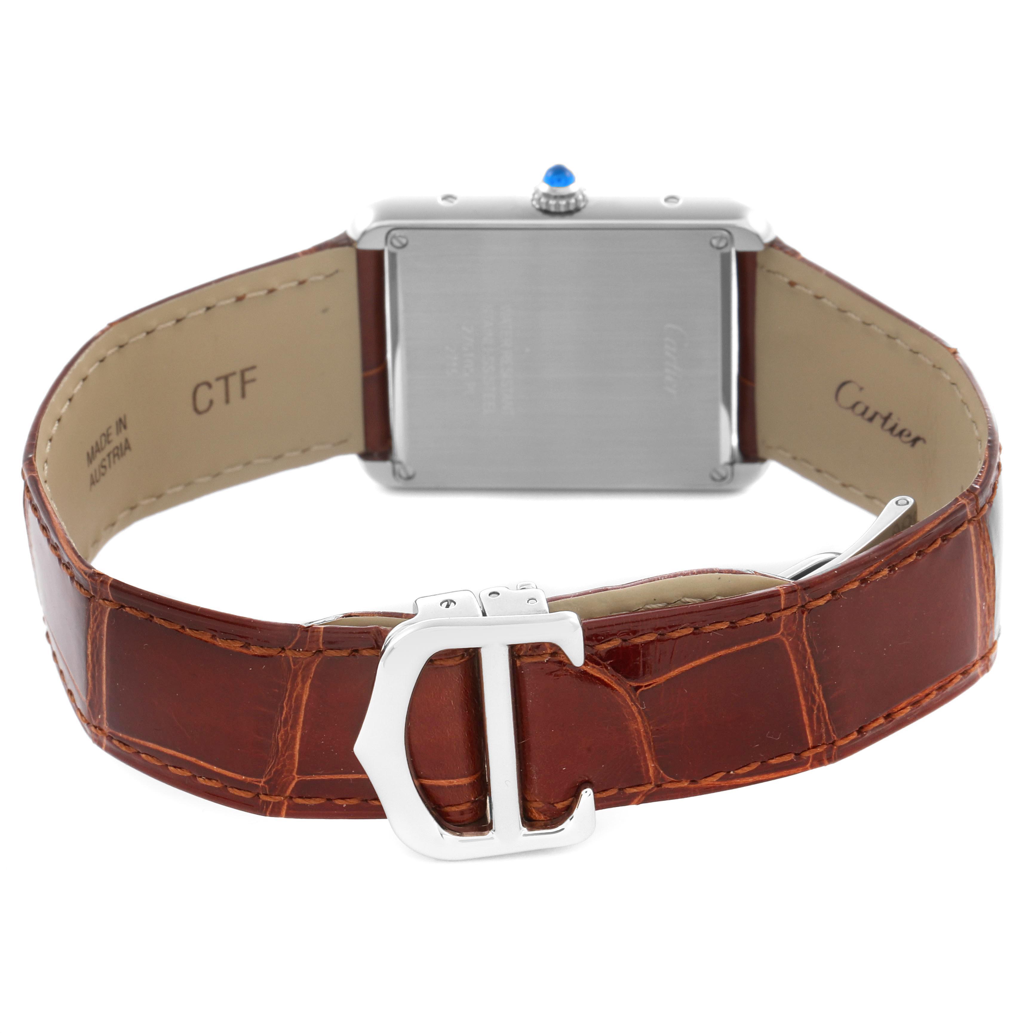 The image shows the back and clasp of the Cartier Tank Solo W1018355 Men
s Stainless Steel Silver Dial W1018355 Men
s Stainless Steel Silver Dial watch, highlighting its leather strap and stainless steel case.