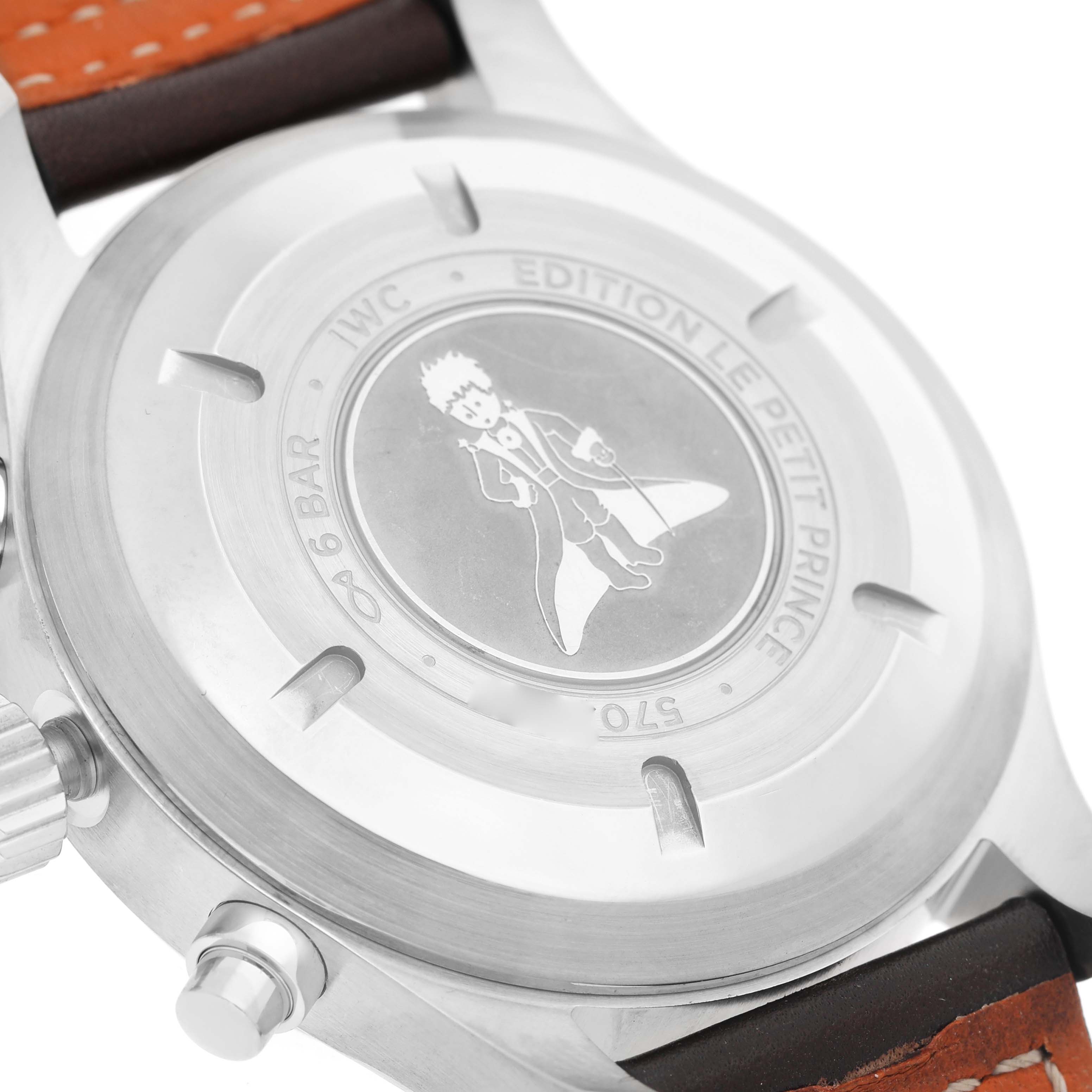 The image shows the back of the IWC Pilot IW377714 Men's Stainless Steel Blue Dial model, featuring the "Le Petit Prince" engraving and adjacent strap parts.