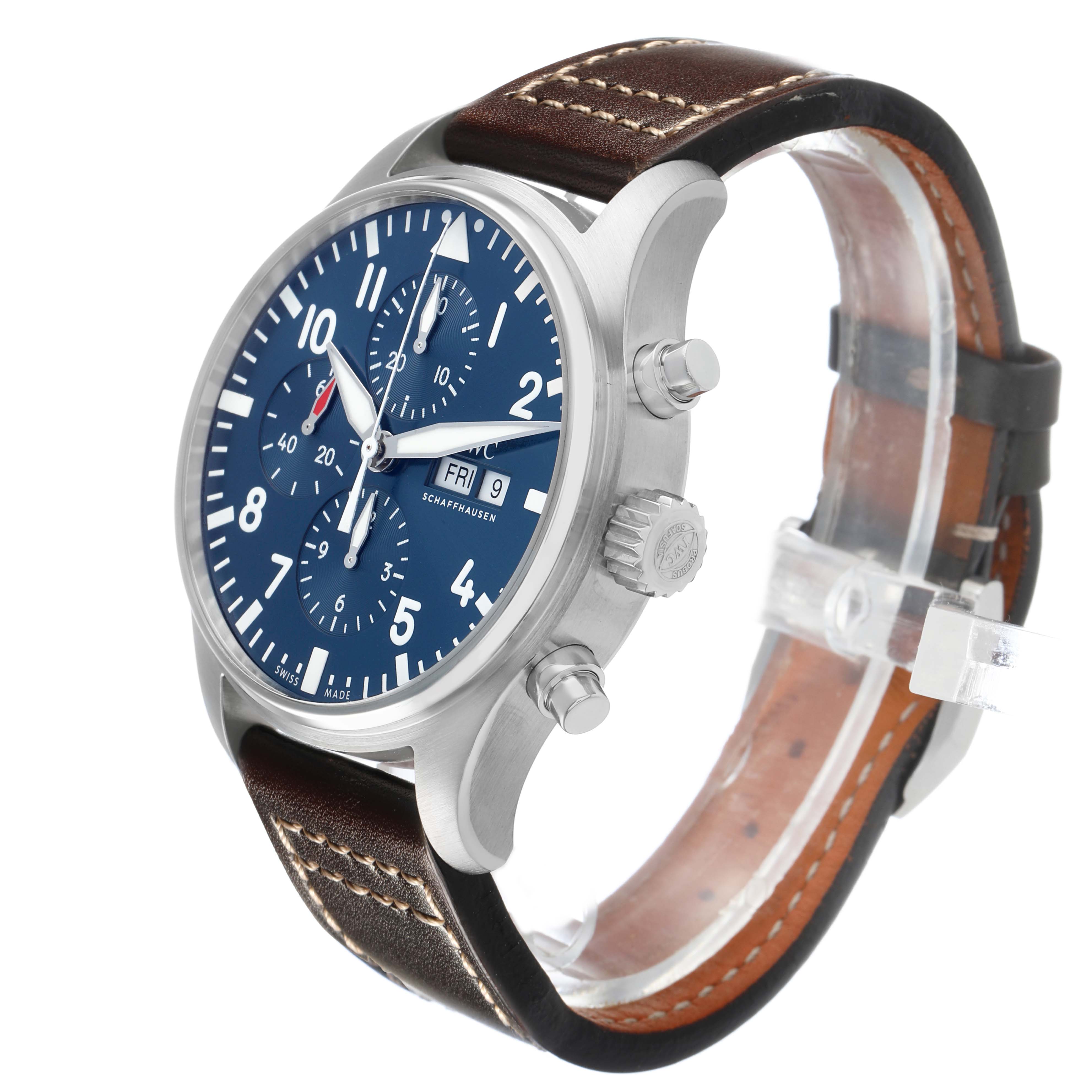 The IWC Pilot IW377714 Men's Stainless Steel Blue Dial watch is shown at a side angle, displaying the face, crown, and pushers, with a brown leather strap.