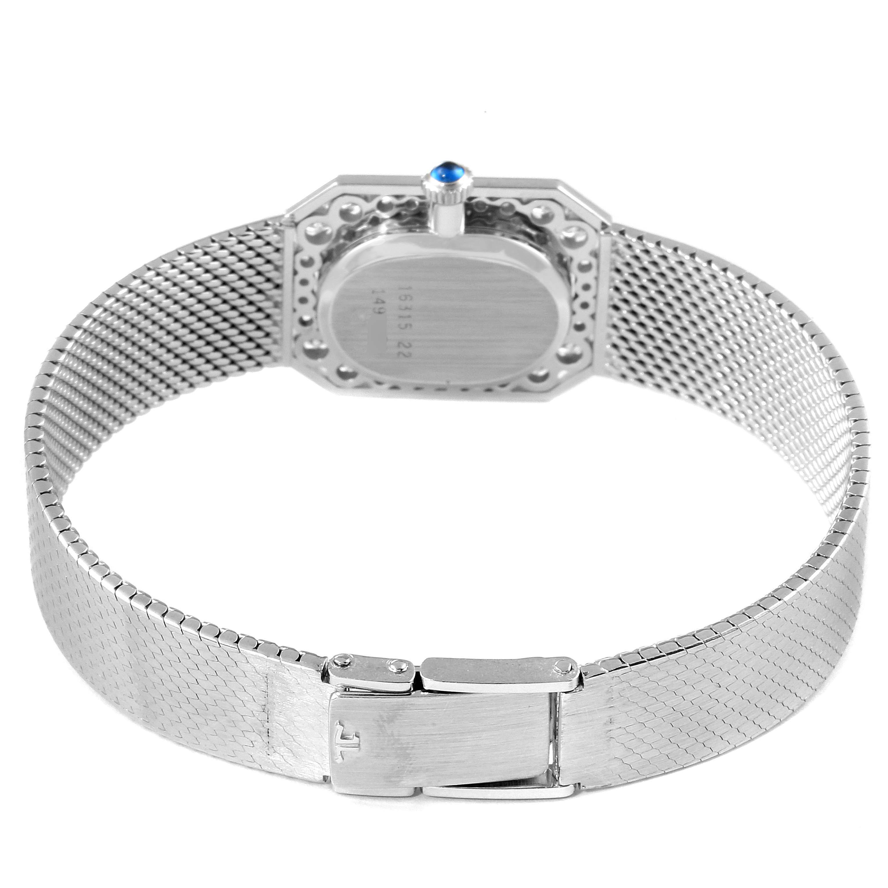 This image shows the back case and metal mesh band of a vintage Jaeger-LeCoultre watch.