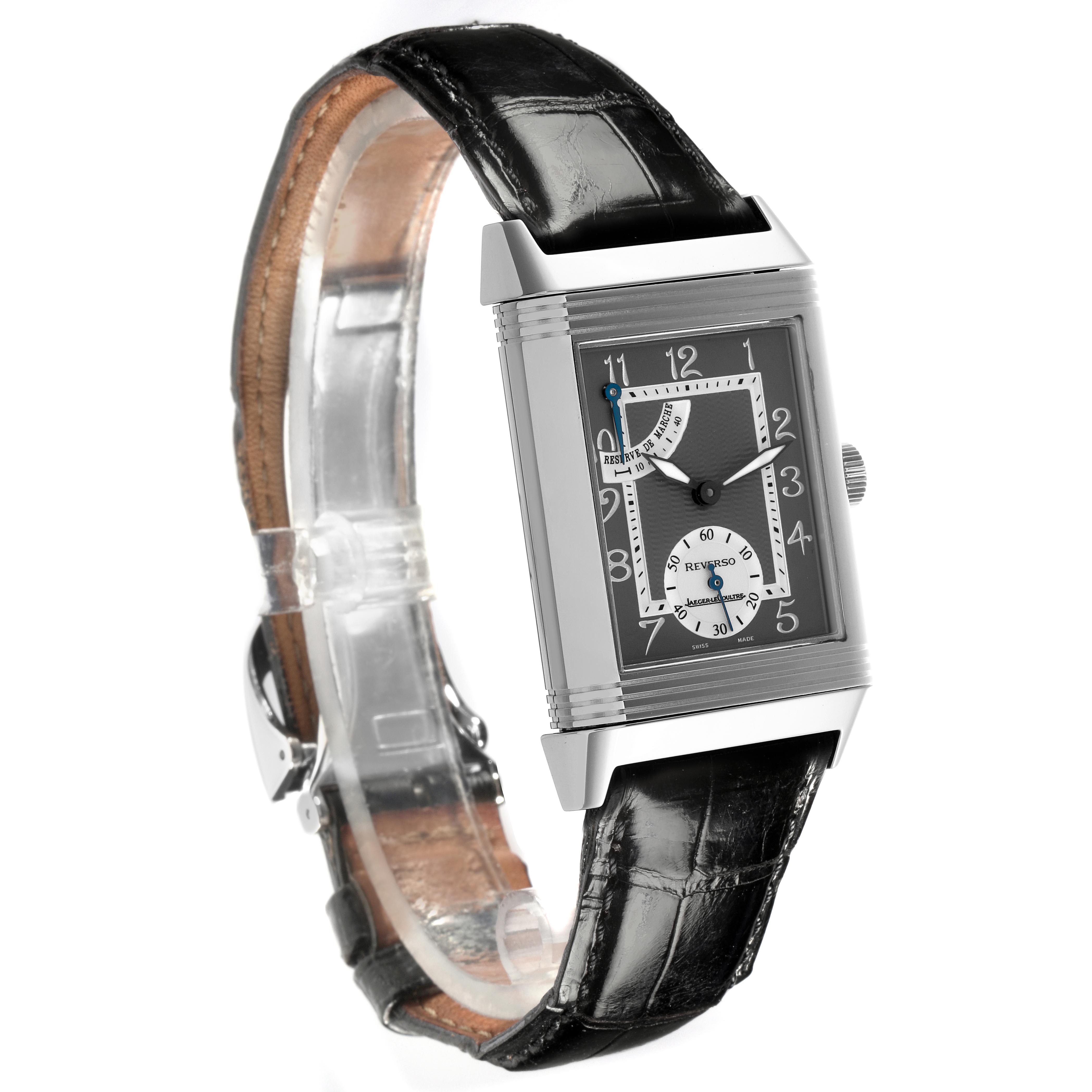 The Jaeger-LeCoultre Reverso watch is shown at an angled side view, highlighting its rectangular face and black leather strap.