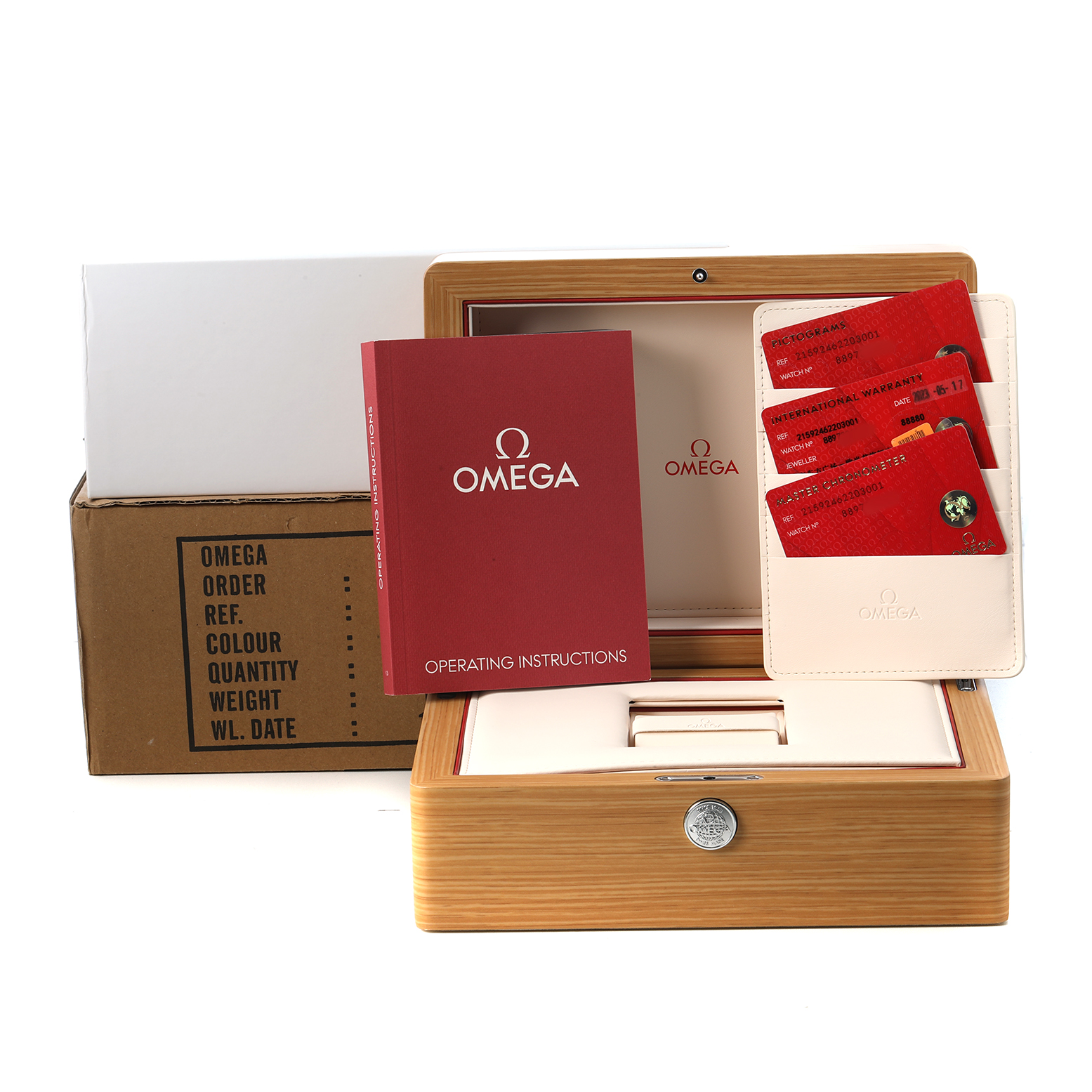 The image shows the Omega Planet Ocean 215.92.46.22.03.001 Men's Ceramic Blue Dial packaging, including the wooden box, instruction booklet, and authenticity cards.