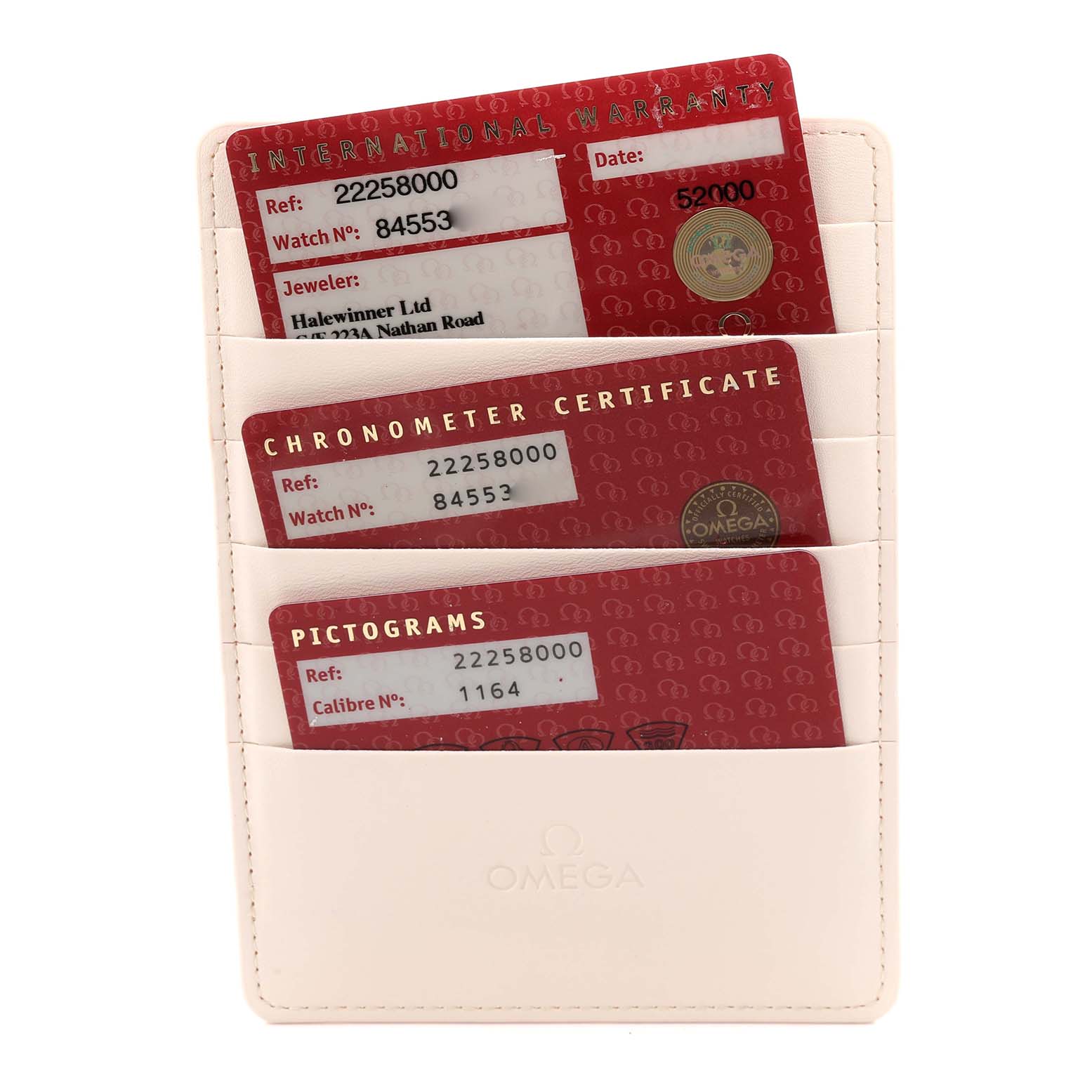 The image shows three Omega Seamaster 2225.80.00 Men
s Stainless Steel Blue Dial 2225.80.00 Men
s Stainless Steel Blue Dial cards: International Warranty, Chronometer Certificate, and Pictograms, in a holder.