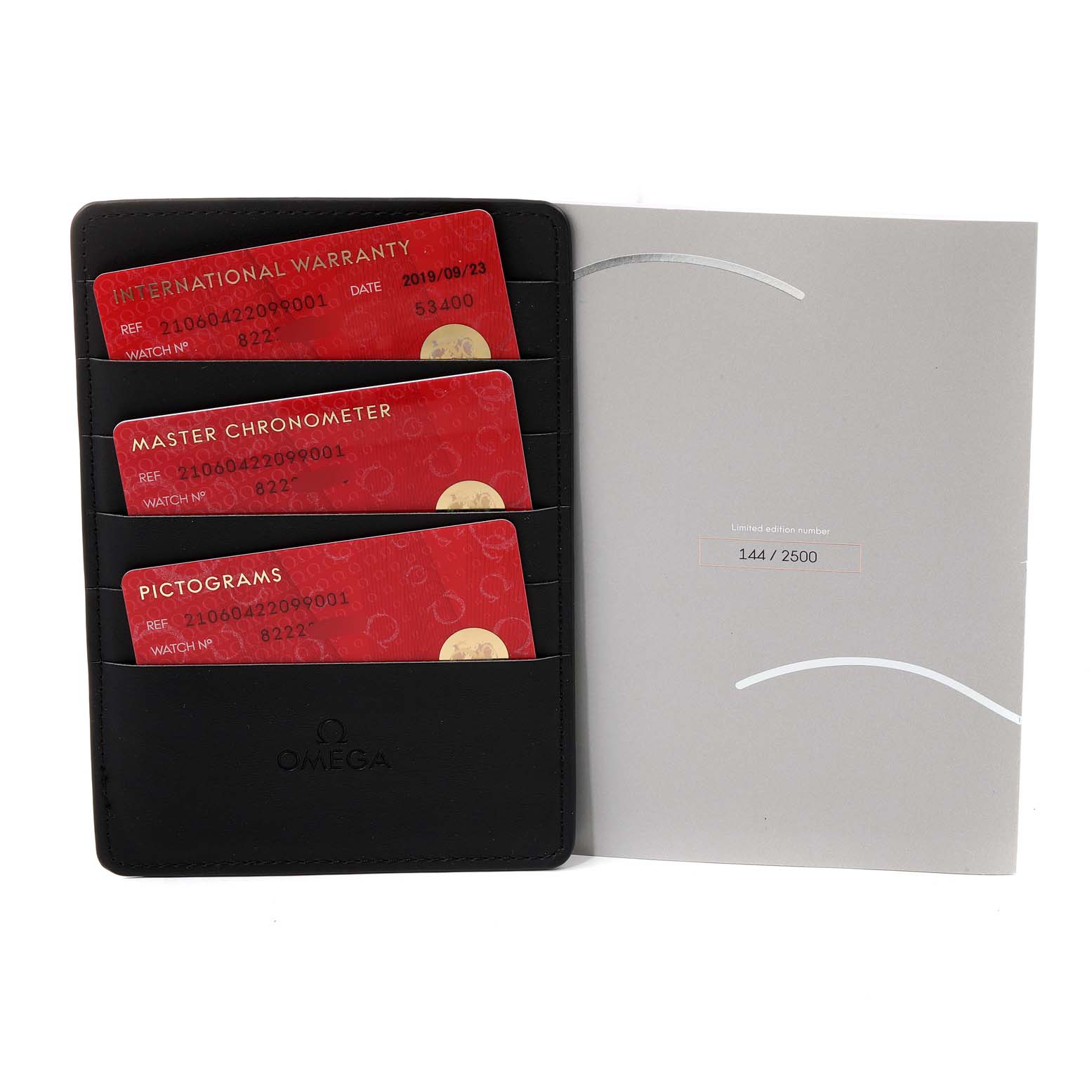 The image shows warranty cards and certification documents for an Omega Seamaster 210.60.42.20.99.001  Men
s Titanium Grey Dial 210.60.42.20.99.001  Men
s Titanium Grey Dial watch.