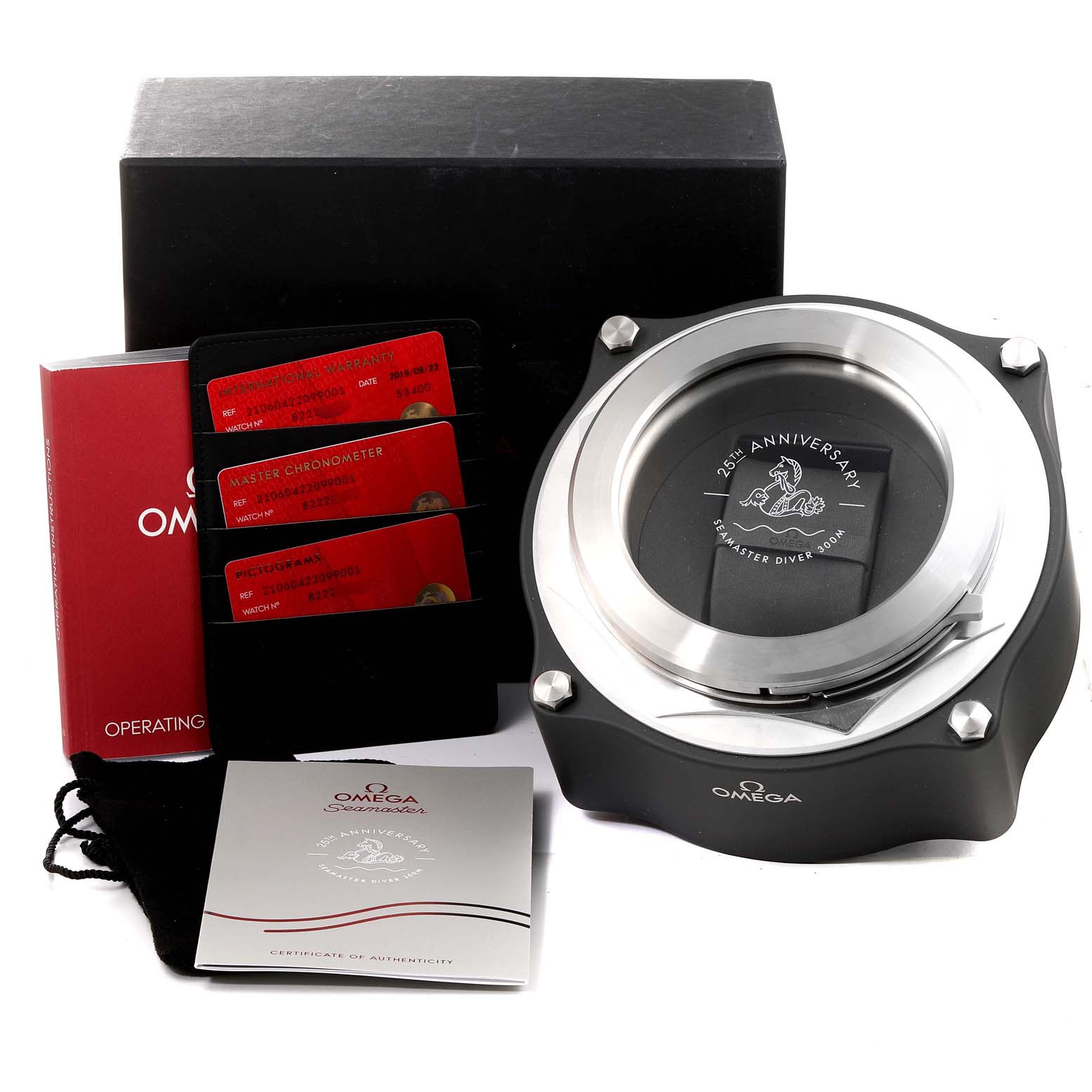 The image shows an Omega Seamaster 210.60.42.20.99.001  Men
s Titanium Grey Dial 210.60.42.20.99.001  Men
s Titanium Grey Dial 25th Anniversary watch box, warranty cards, operating instructions, and a certificate of Best Quality
ity.