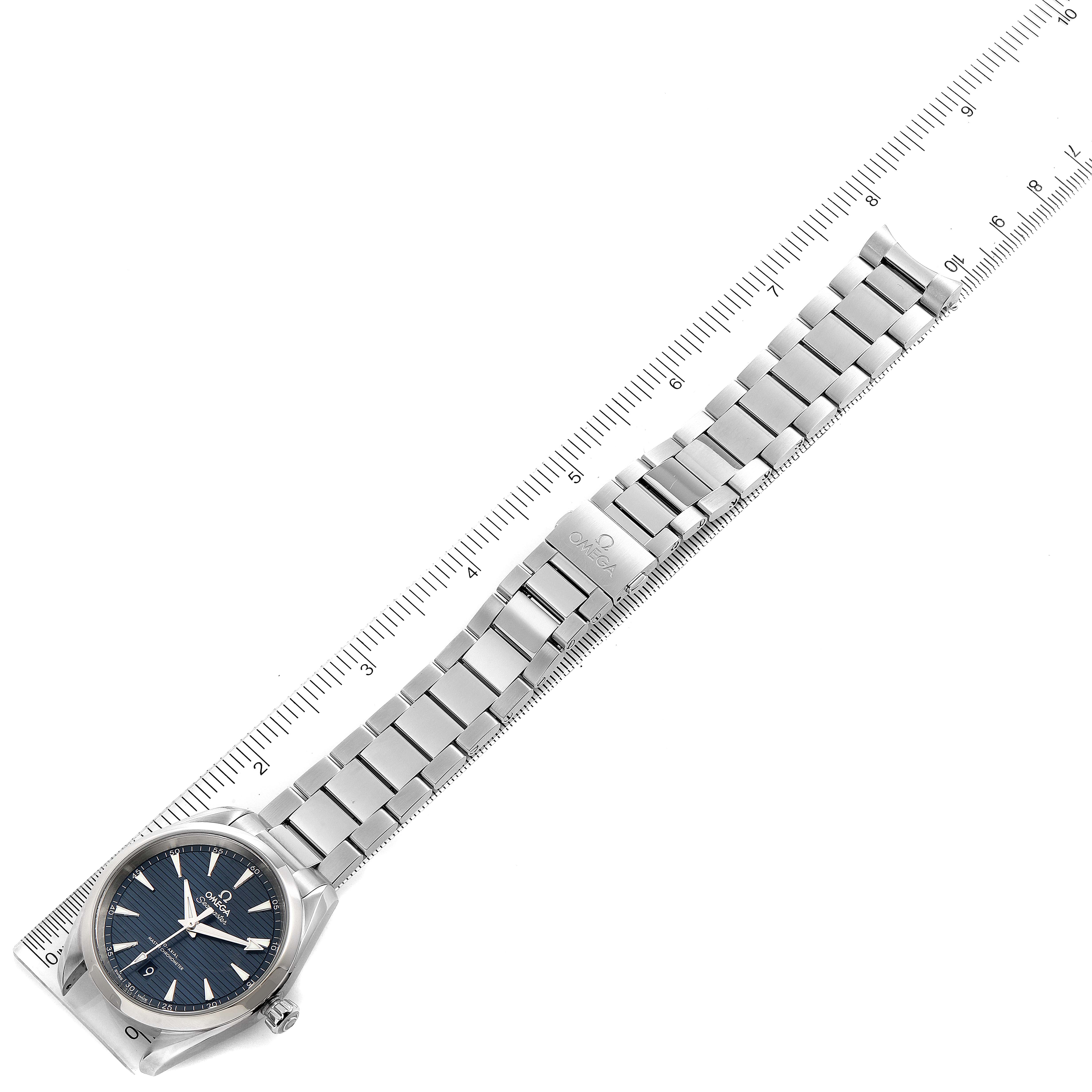 The image shows an Omega Aqua Terra 220.10.38.20.03.001 Men
s Stainless Steel Blue Dial 220.10.38.20.03.001 Men
s Stainless Steel Blue Dial watch laid flat with a ruler to measure its length.