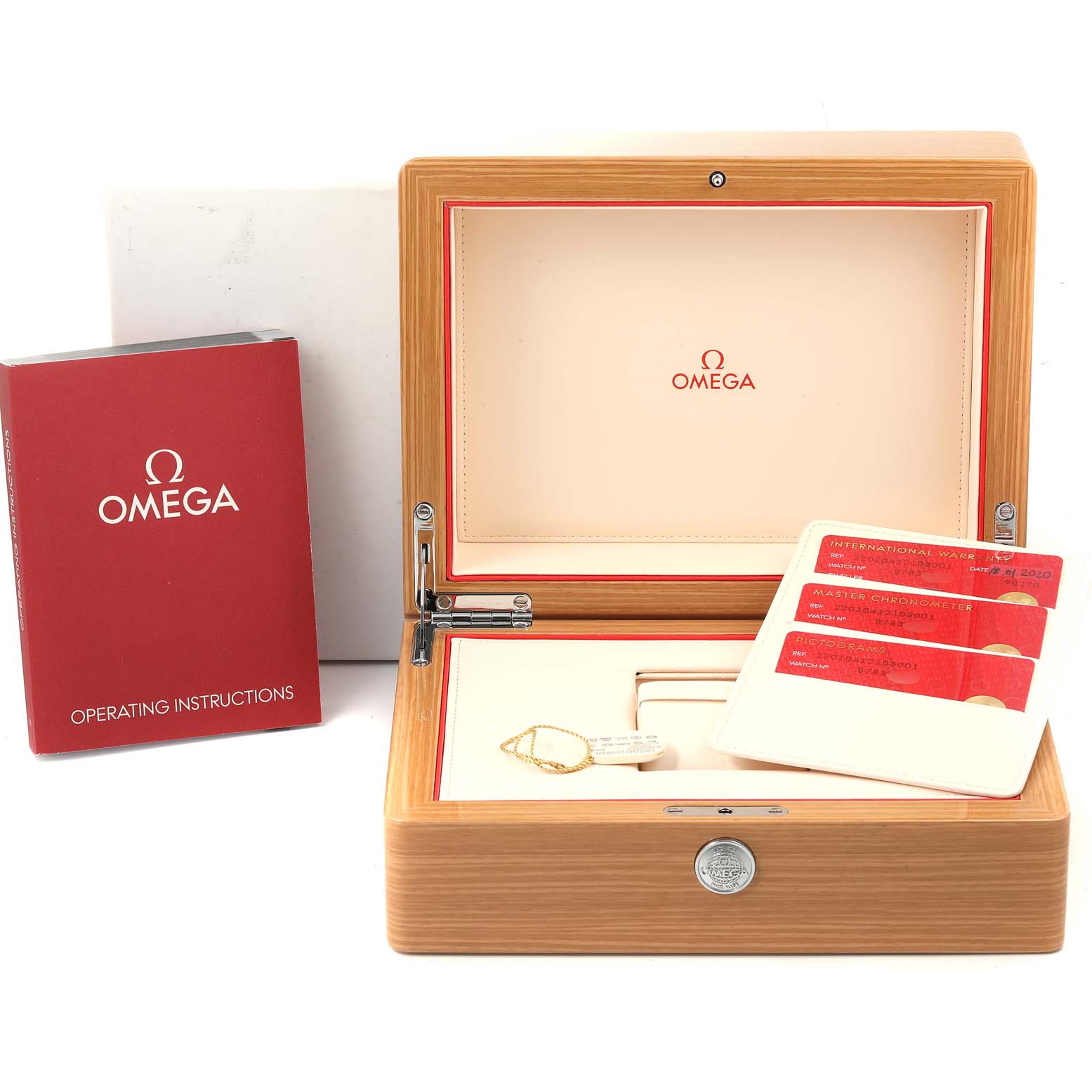 This image shows the open wooden box of the Omega Aqua Terra 220.10.41.21.03.001 Men's Stainless Steel Blue Dial 220.10.41.21.03.001 Men's Stainless Steel Blue Dial watch, operating instructions, and warranty cards.