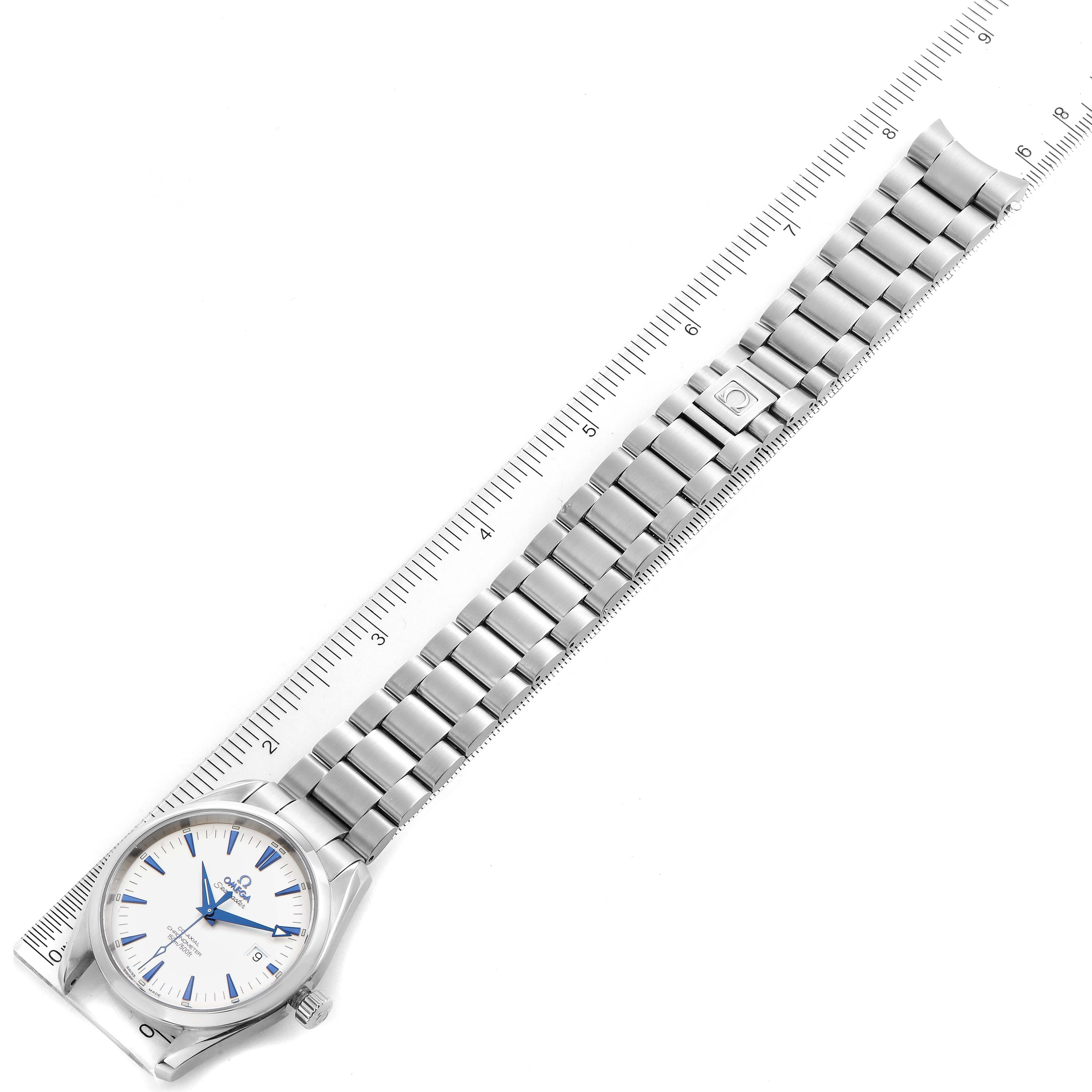 The Omega Aqua Terra 2503.33.00 Men
s Stainless Steel Silver Dial 2503.33.00 Men
s Stainless Steel Silver Dial watch is shown from an overhead angle, displaying the face, case, and metal bracelet alongside a ruler.