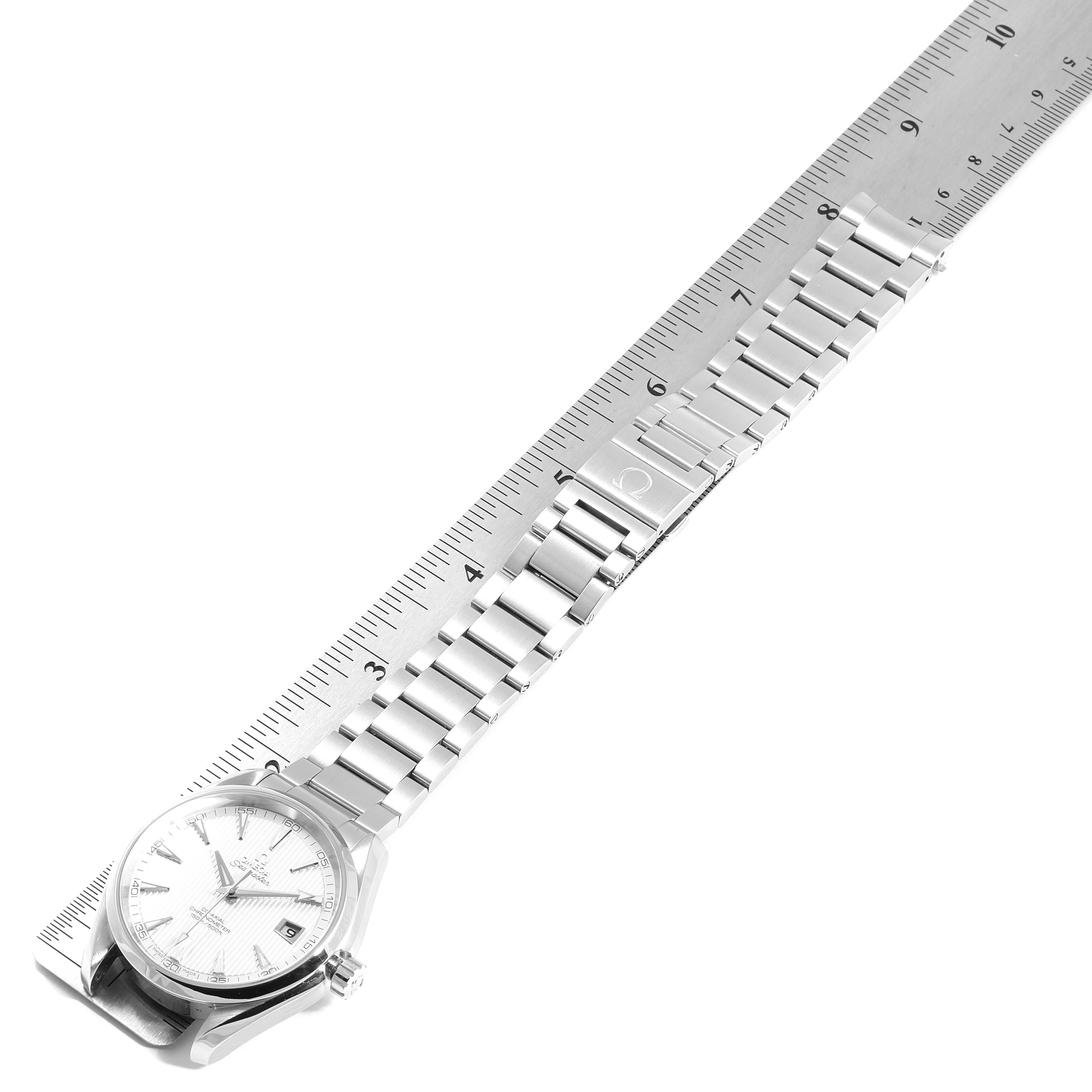 The Omega Aqua Terra 231.10.42.21.02.001 Men
s Stainless Steel Silver Dial 231.10.42.21.02.001 Men
s Stainless Steel Silver Dial watch is shown from a top-down angle, displaying its face and stainless steel bracelet aligned with a ruler.