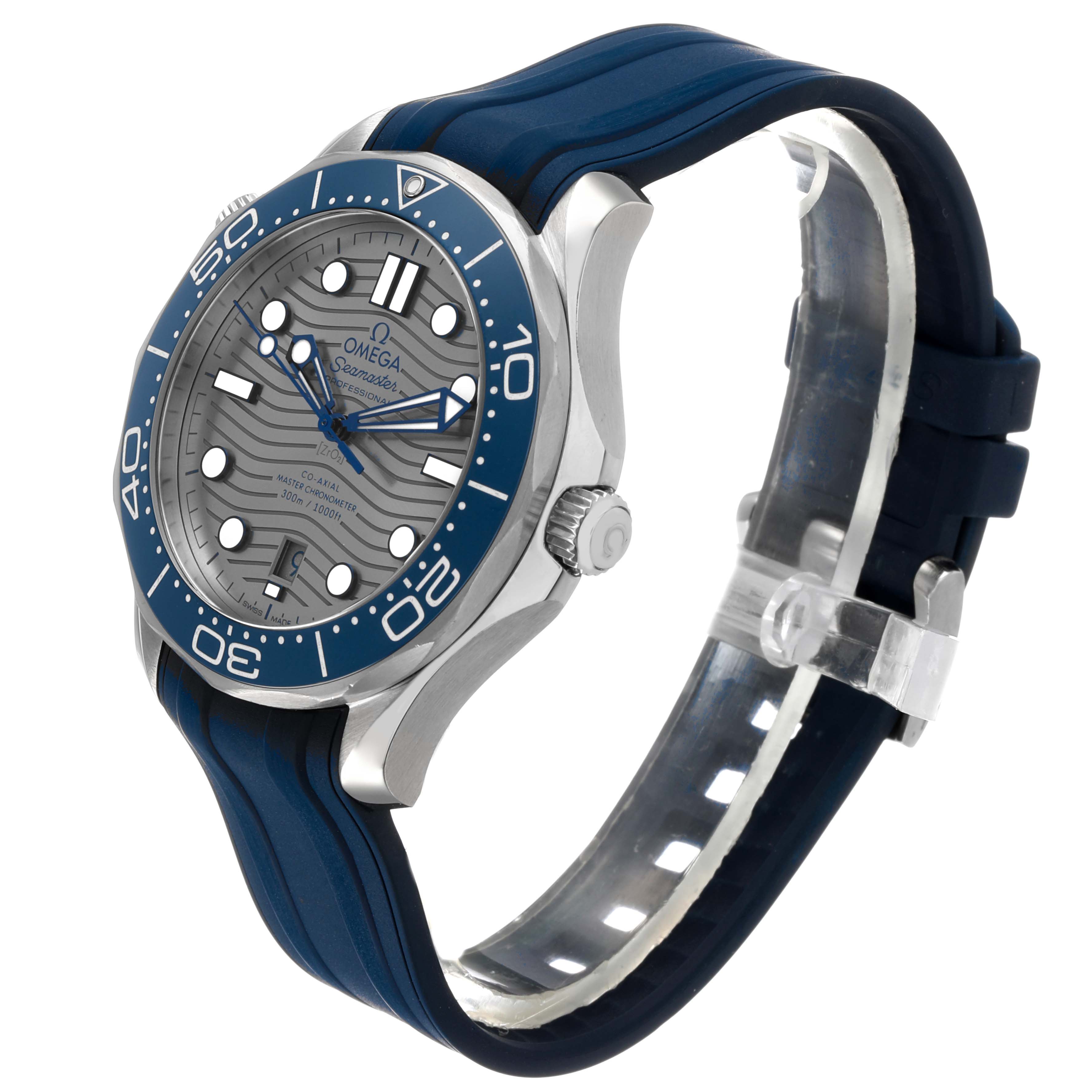 The Omega Seamaster 210.32.42.20.06.001 Men's Stainless Steel Grey Dial watch is shown at a three-quarter angle with a clear view of the blue bezel, wave-pattern dial, and rubber strap.