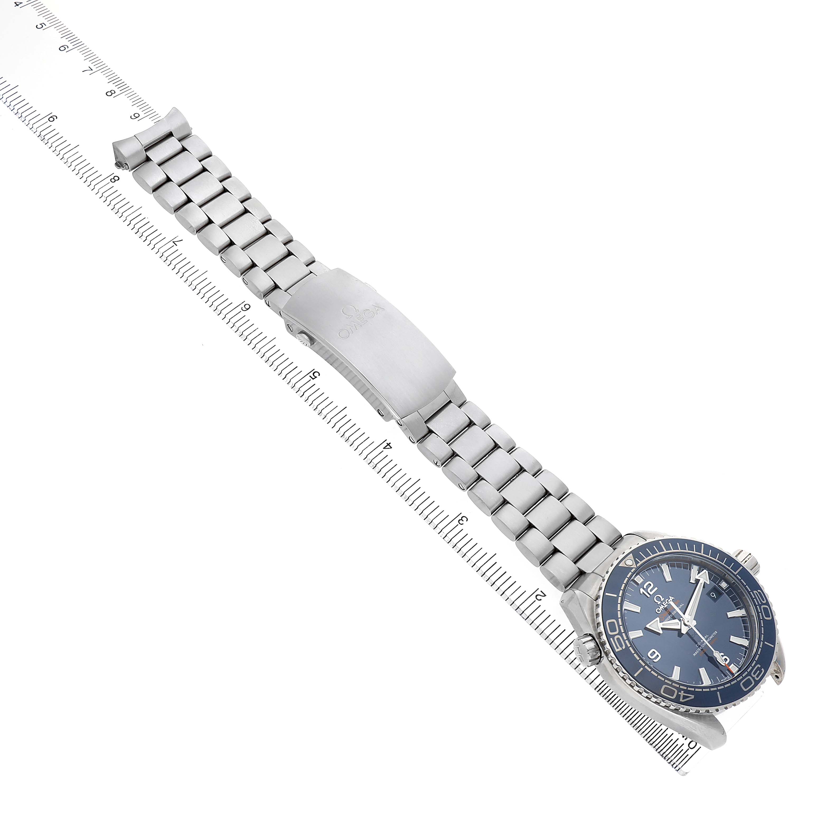 The Omega Planet Ocean 215.30.44.21.03.001 Men's Stainless Steel Blue Dial watch is shown from an overhead angle, displaying the bracelet, clasp, and watch face.