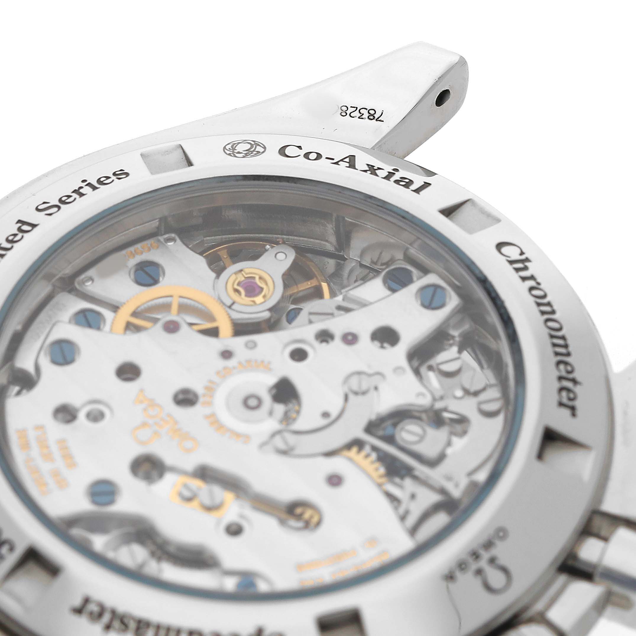 The image shows the back of the Omega Speedmaster 311.33.42.50.01.001 Men's Stainless Steel Black Dial, highlighting the Co-Axial movement and intricate mechanical details.