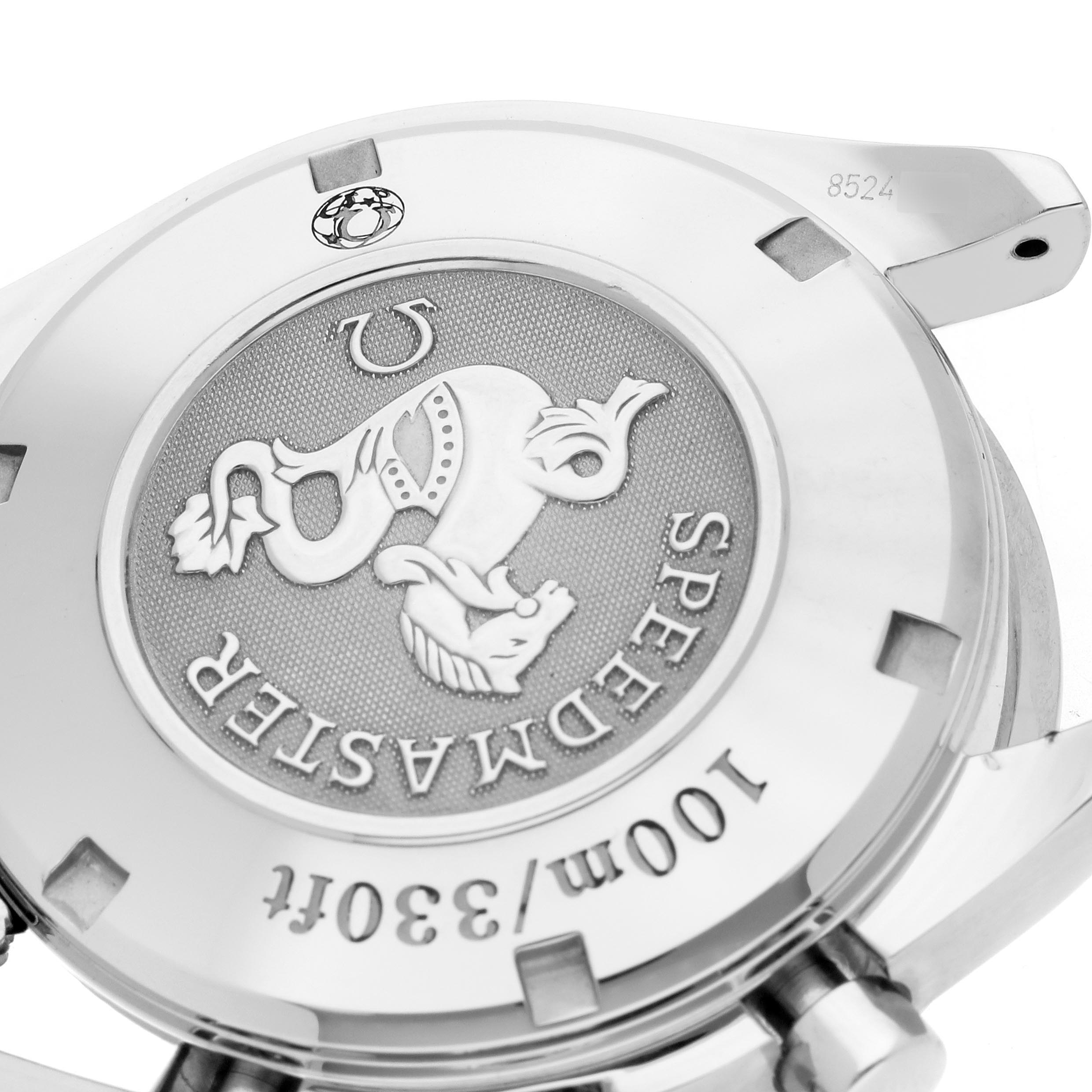 The image shows a close-up of the back case of an Omega Speedmaster 323.10.40.40.02.001 Men
s Stainless Steel Silver Dial 323.10.40.40.02.001 Men
s Stainless Steel Silver Dial watch, highlighting the emblem and engraving details.