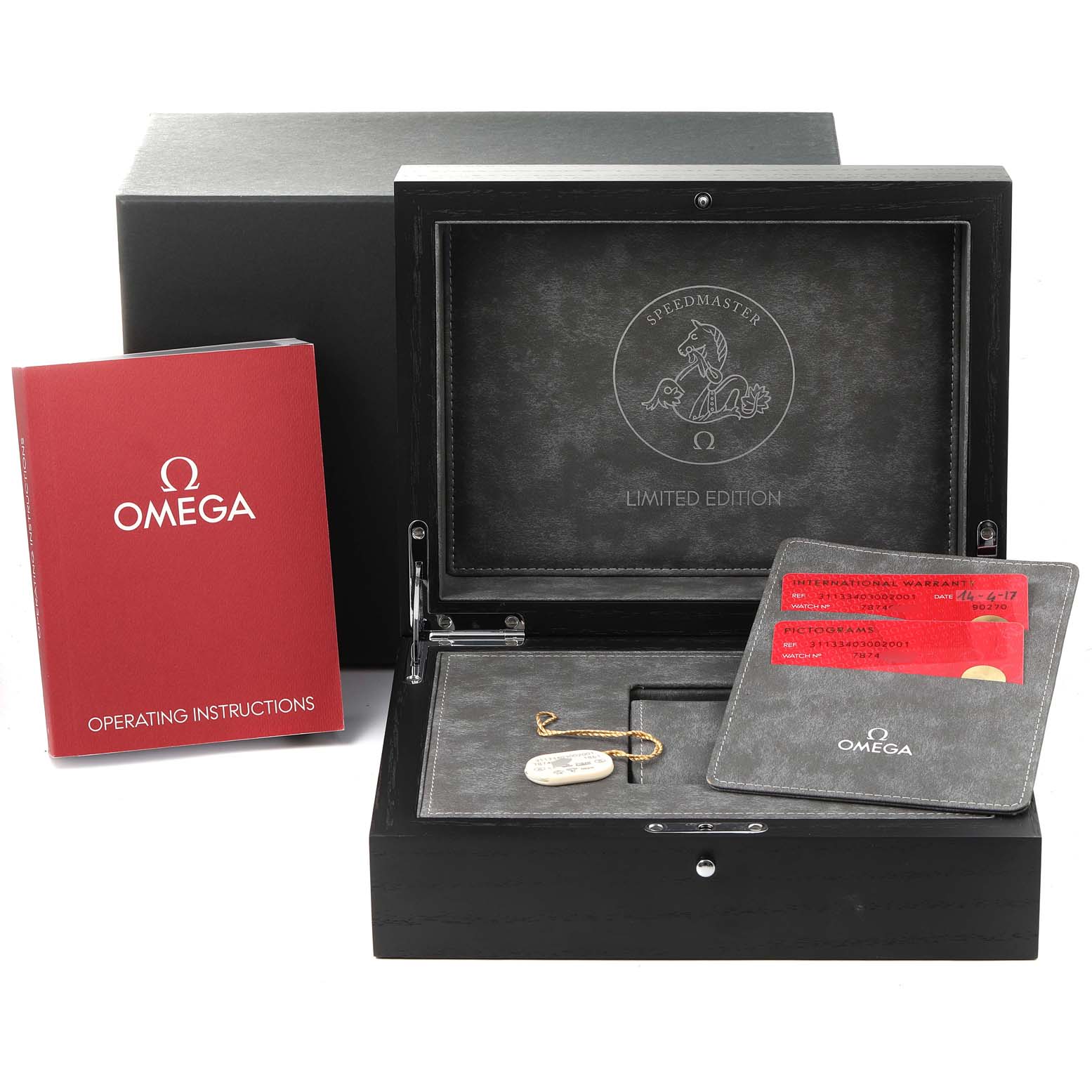 The image shows the case, operating instructions, and certification cards for the Omega Speedmaster 311.33.40.30.02.001 Men's Stainless Steel Silver Dial 311.33.40.30.02.001 Men's Stainless Steel Silver Dial watch.