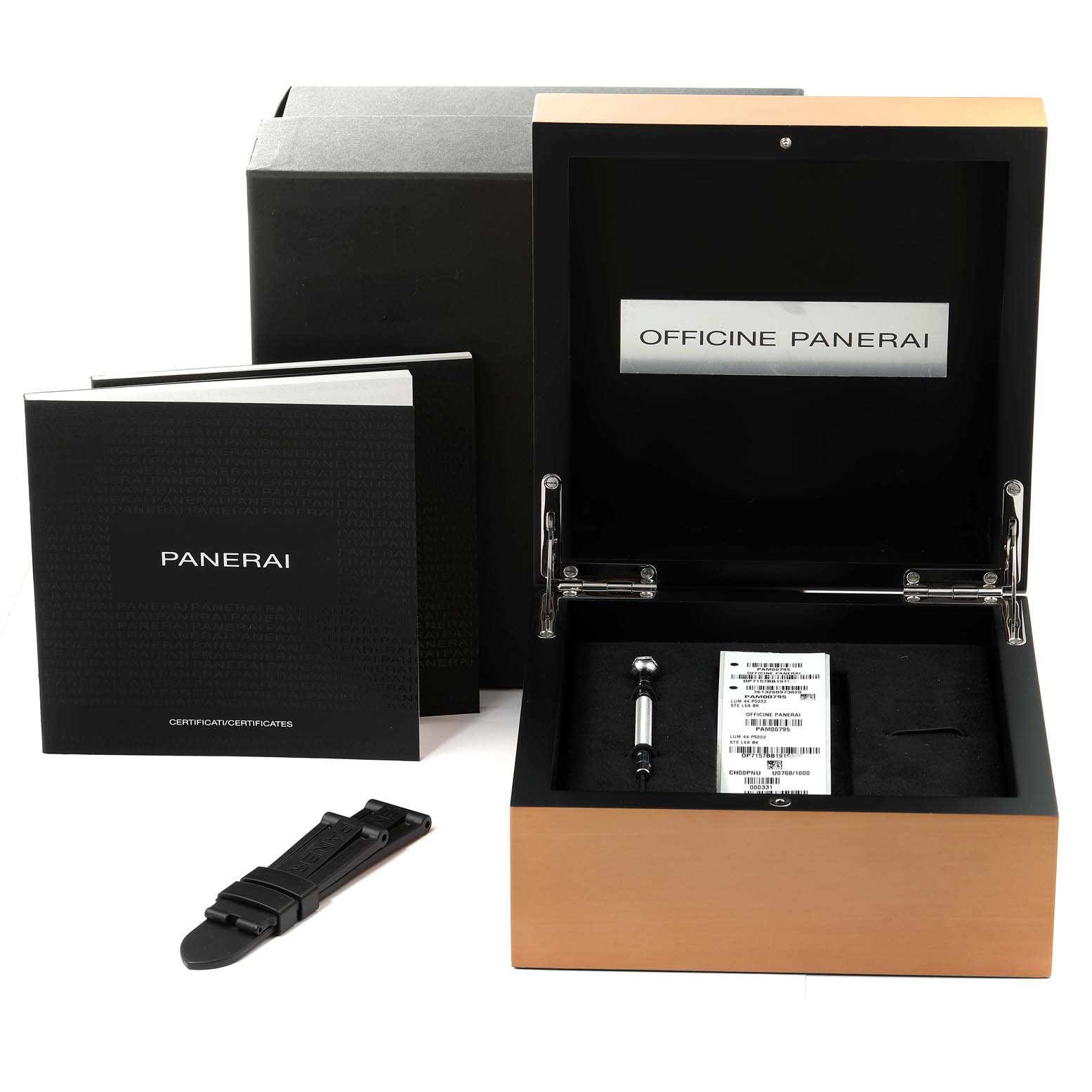 The image shows the packaging and accessories for a Panerai Luminor PAM00795 Men
s Stainless Steel Black Dial PAM00795 Men
s Stainless Steel Black Dial watch, including the box, an additional strap, and documentation.