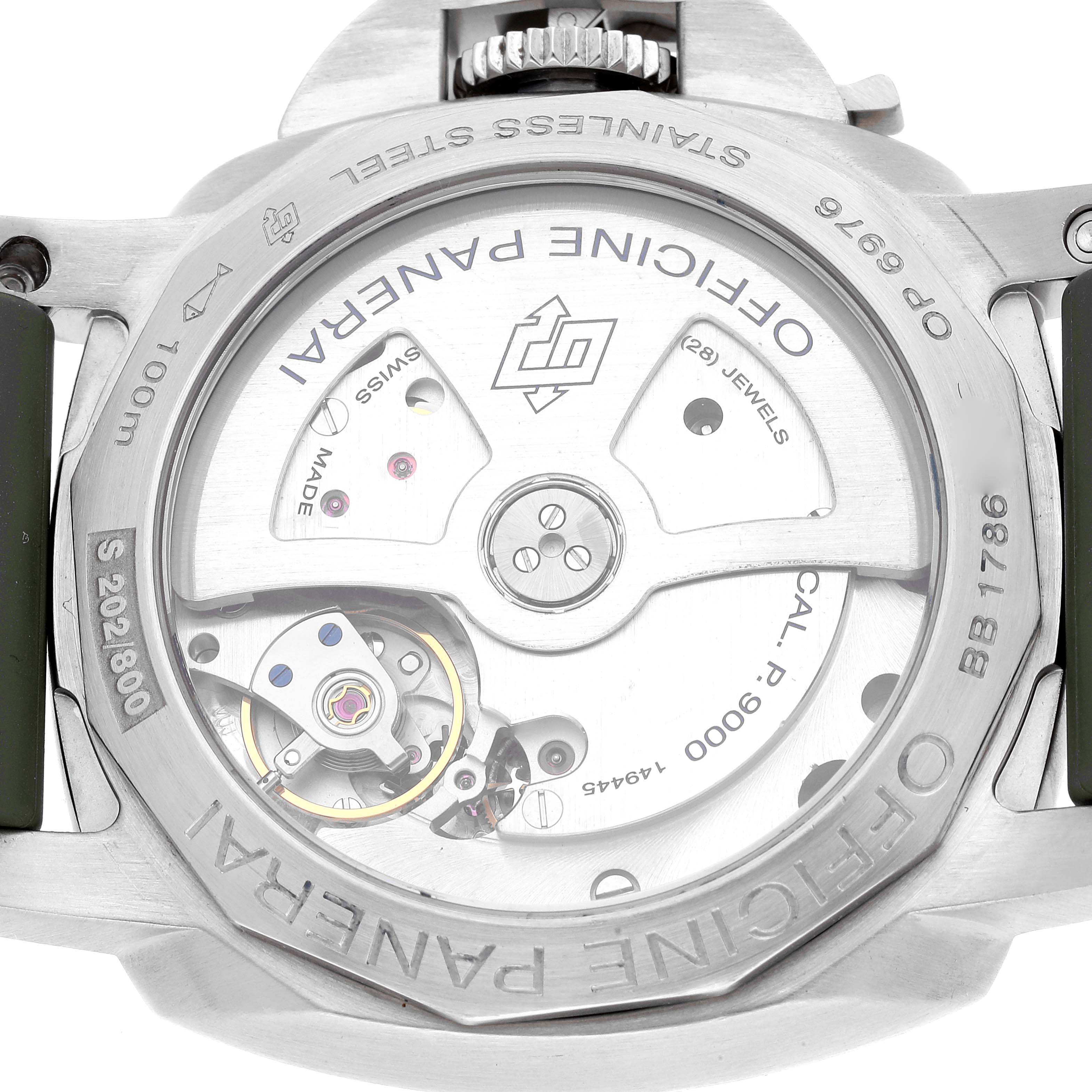 The image shows the back of a Luminor model by Panerai, highlighting its movement and internal components.