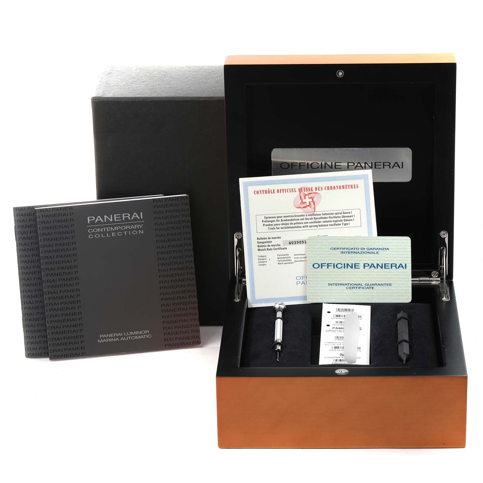 The image shows the accessories for a Panerai Luminor PAM00299 Men
s Stainless Steel Black Dial PAM00299 Men
s Stainless Steel Black Dial watch, including booklets, certificates, and tools, all presented from a front angle.